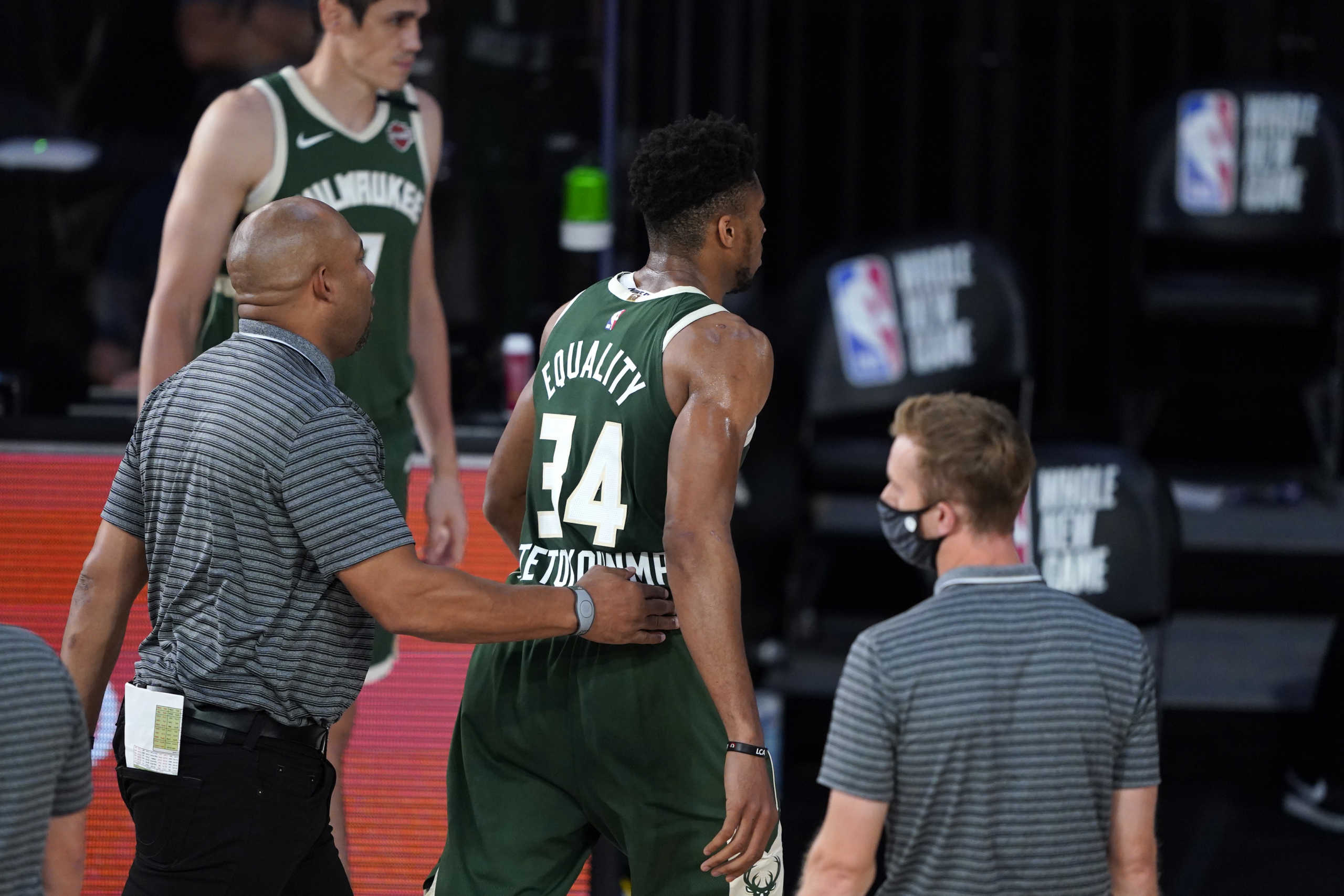 Aug 11, 2020; Lake Buena Vista, Florida, USA; Milwaukee Bucks' Giannis Antetokounmpo (34) heads to the locker room after being ejected during the first half of an NBA basketball game against the Washington Wizards, Tuesday, Aug. 11, 2020, in Lake Buena Vista, Fla. at Visa Athletic Center. Mandatory Credit: Ashley Landis
