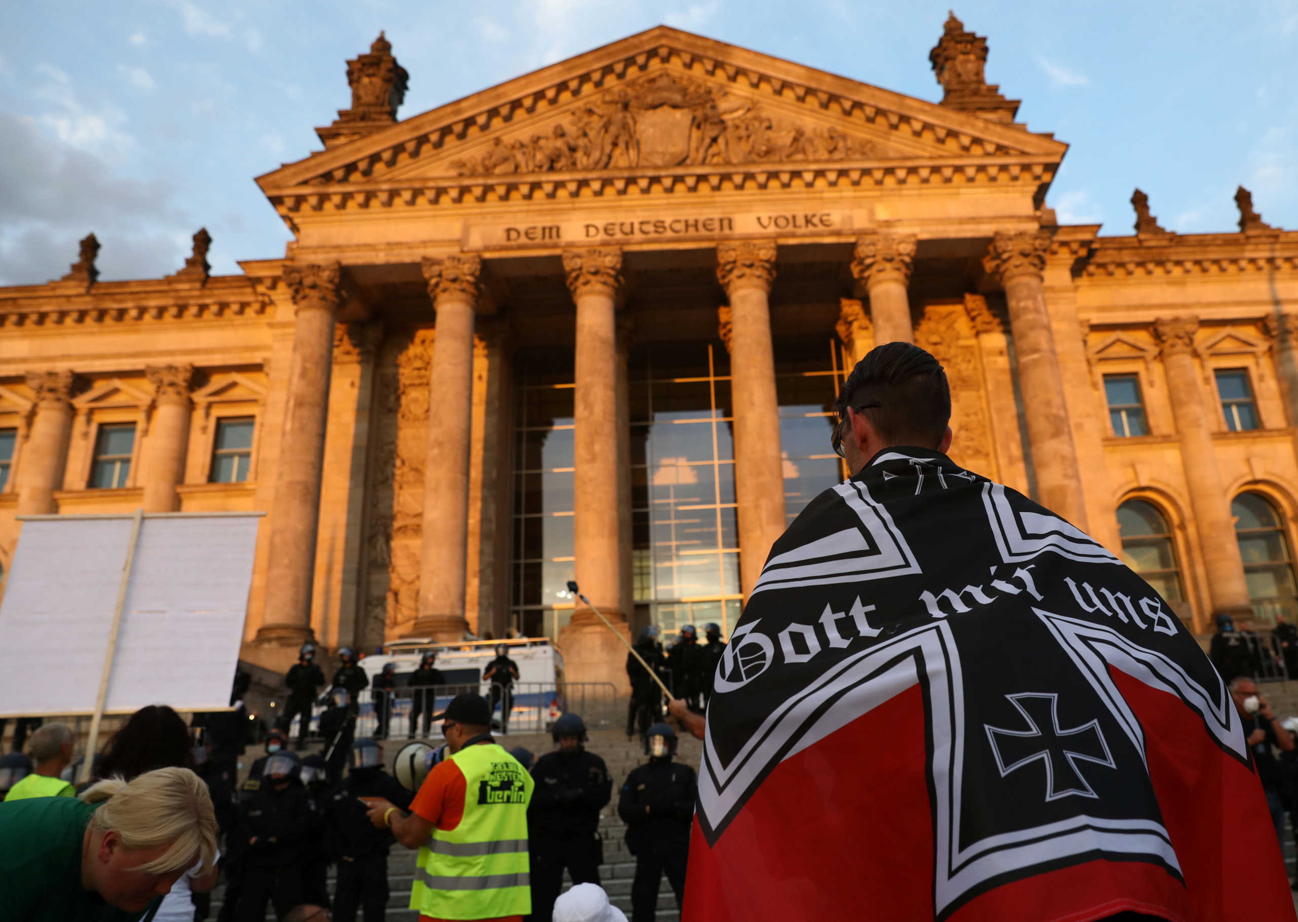 Protesters demonstrate in front of the Reichstag Building during a rally against the government's restrictions following the coronavirus disease (COVID-19) outbreak, in Berlin, Germany, August 29, 2020. REUTERS