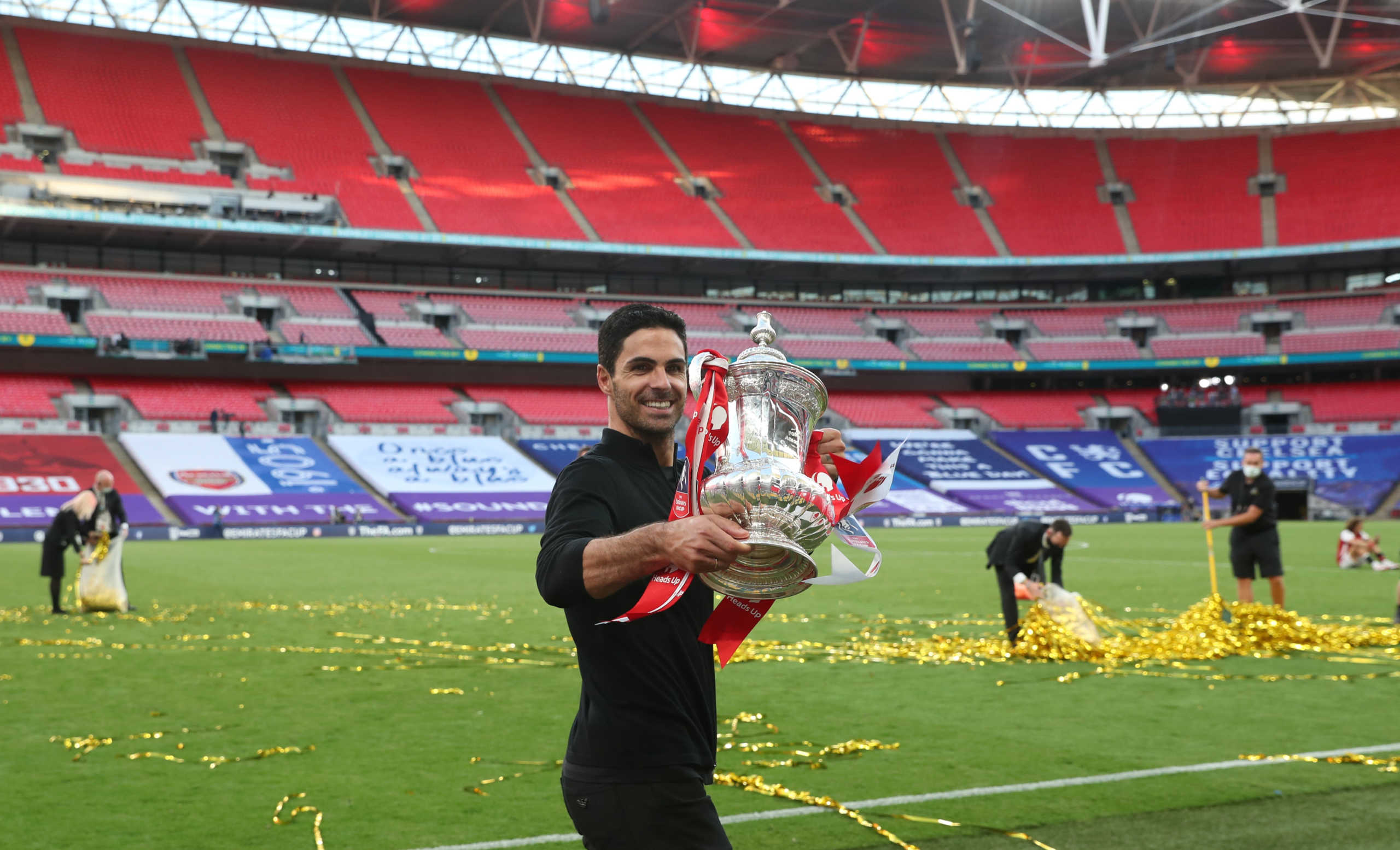 Soccer Football - FA Cup Final - Arsenal v Chelsea - Wembley Stadium, London, Britain - August 1, 2020 Arsenal manager Mikel Arteta celebrates with the trophy after winning the FA Cup, as play resumes behind closed doors following the outbreak of the coronavirus disease (COVID-19) Pool via REUTERS
