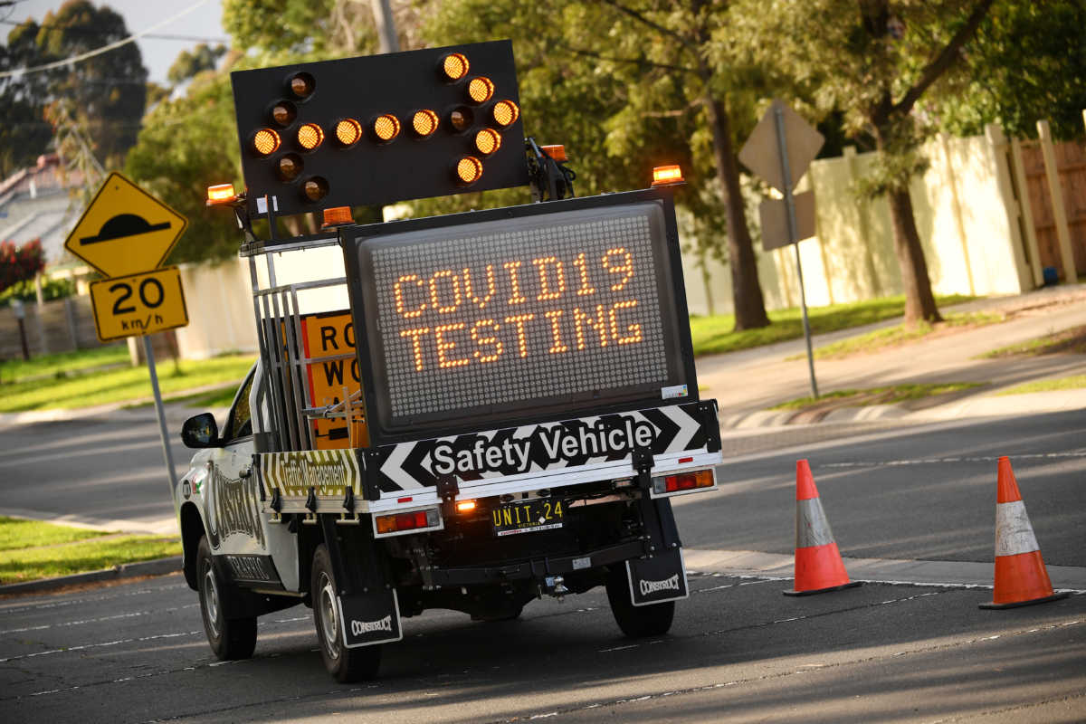 A sign points toward the entrance of a coronavirus disease (COVID-19) drive-through testing facility in Melbourne, Australia, August 18, 2020. Picture taken August 18, 2020.  AAP Image