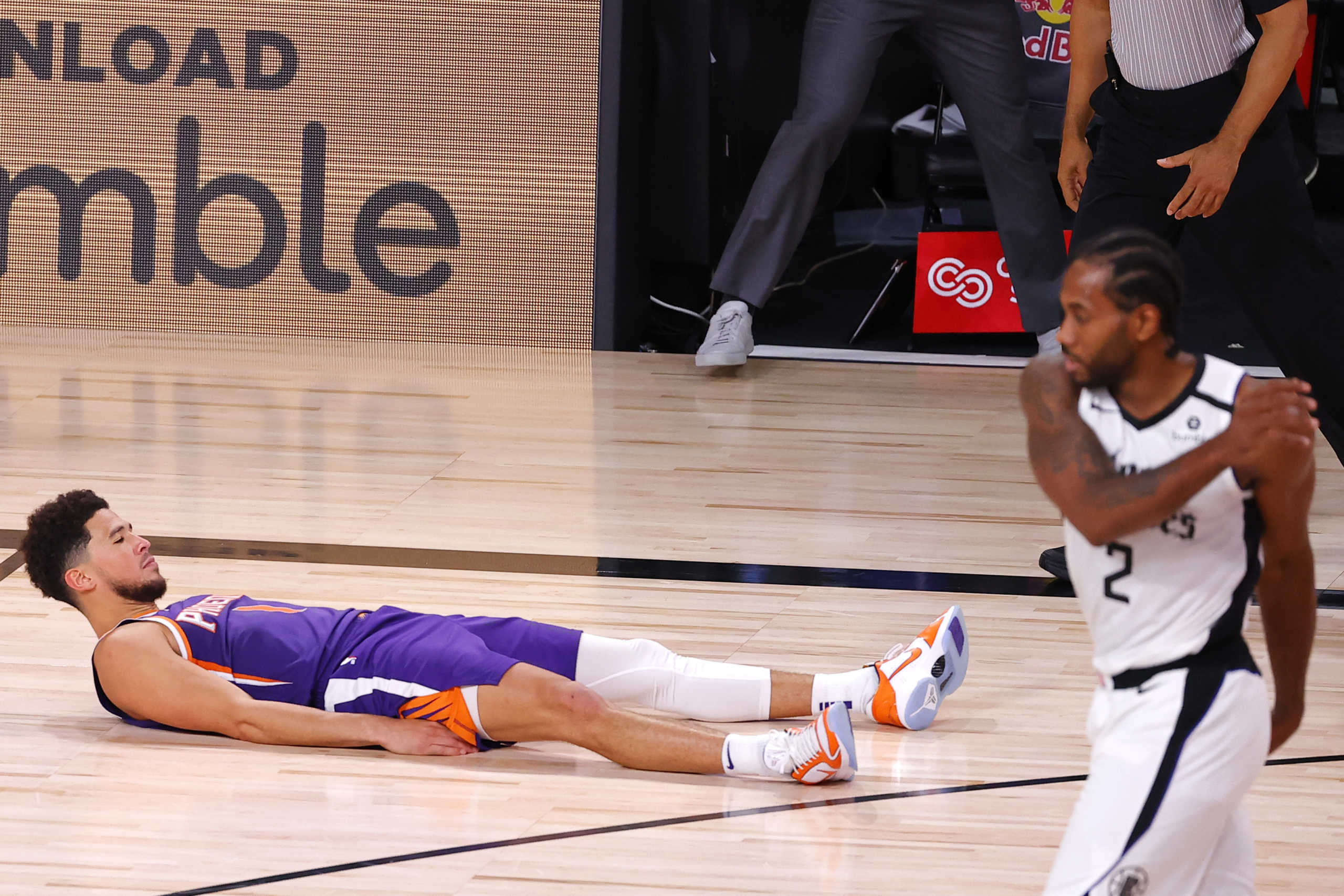 Aug 4, 2020; Lake Buena Vista, USA; Devin Booker #1 of the Phoenix Suns falls to the ground after scoring the game winning basket against the LA Clippers at The Arena at ESPN Wide World Of Sports Complex on August 04, 2020 in Lake Buena Vista, Florida. Mandatory Credit: Kevin C. Cox