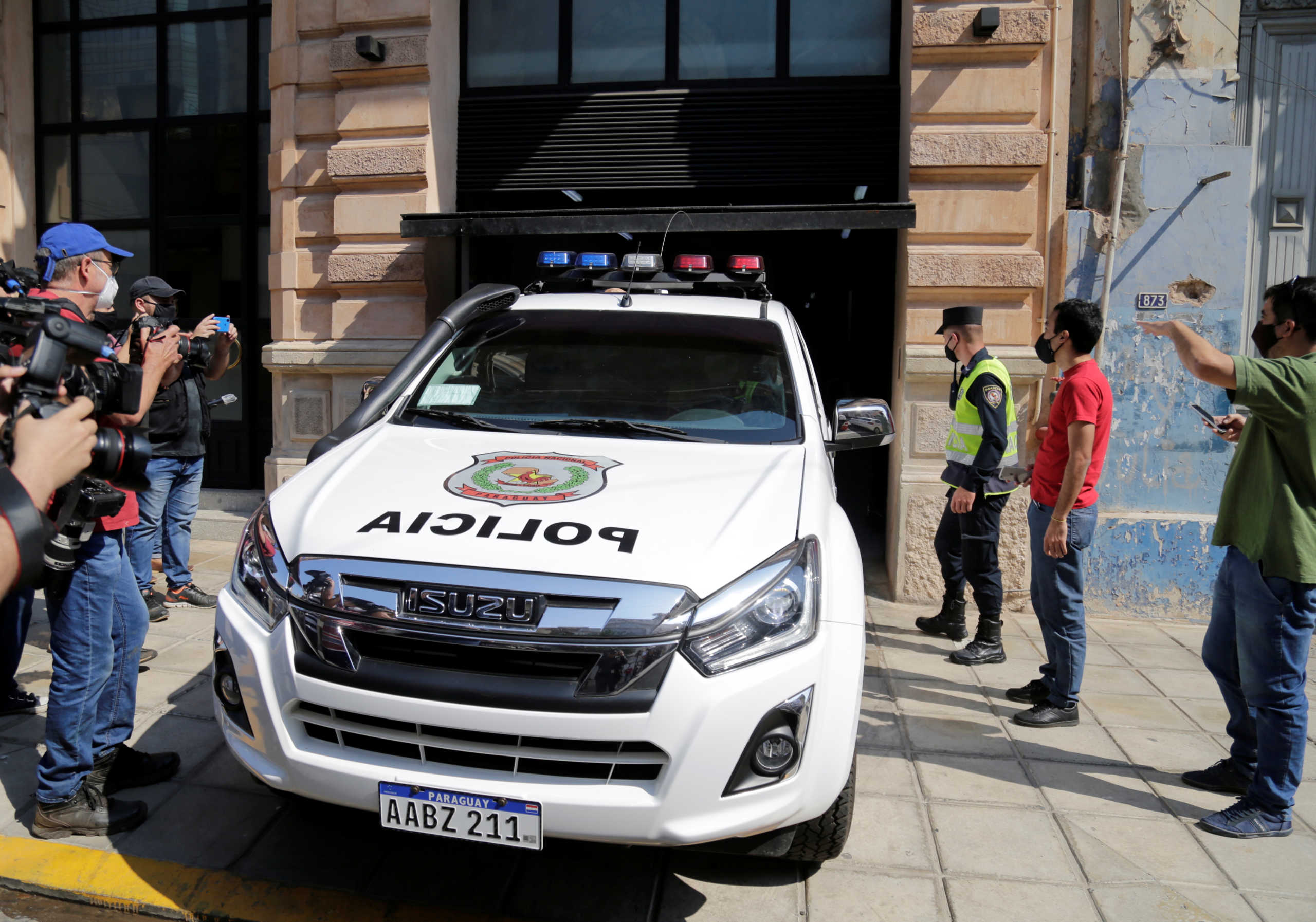 A Paraguayan police vehicle transfers Ronaldinho from the hotel where he has been under house arrest for four months in Asuncion, Paraguay, August 24, 2020. REUTERS