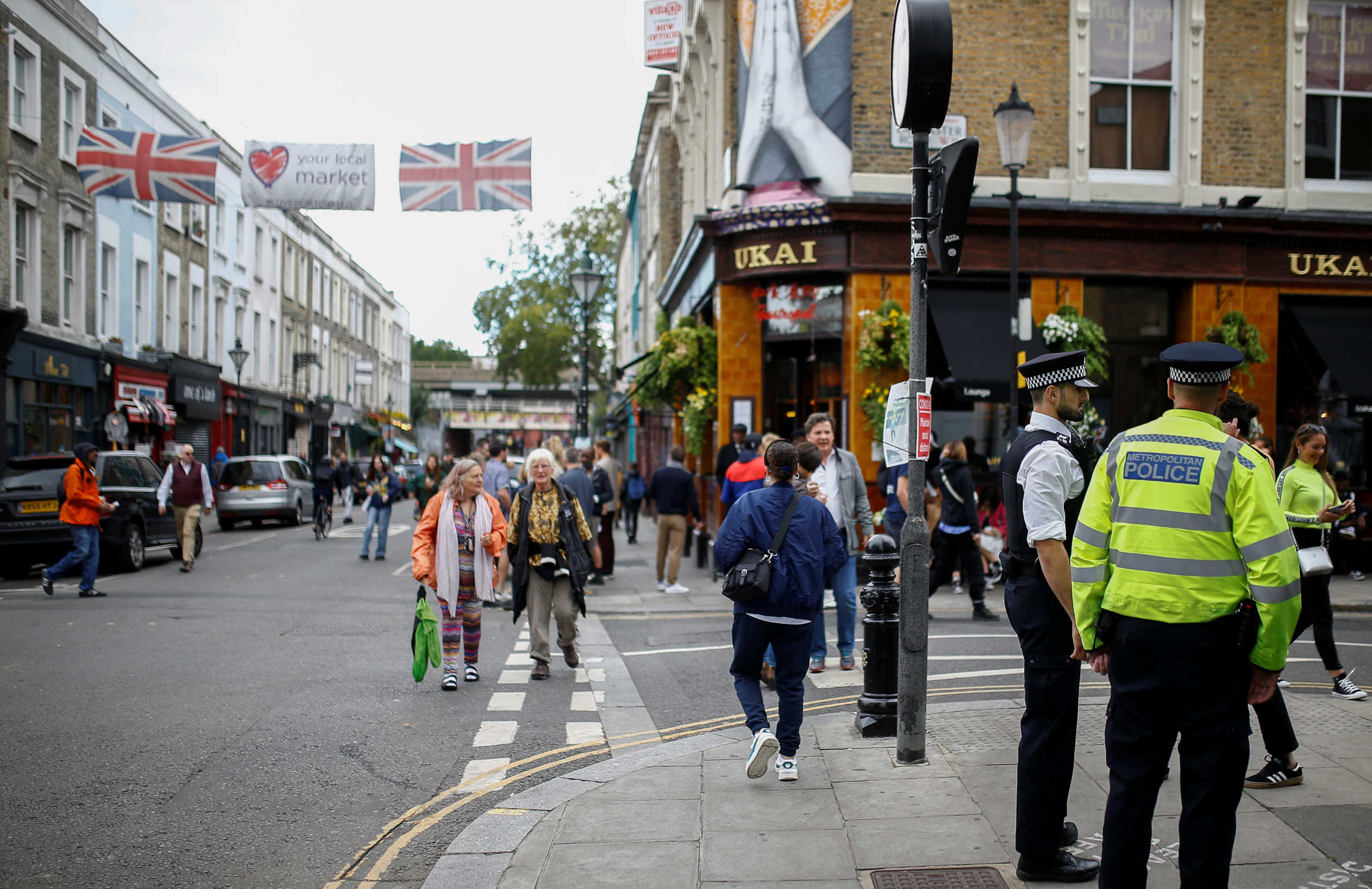 People walk in Portobello Road where Carnival is normally held annually, amid the coronavirus disease (COVID-19) outbreak, in London, Britain, August 30, 2020. REUTERS