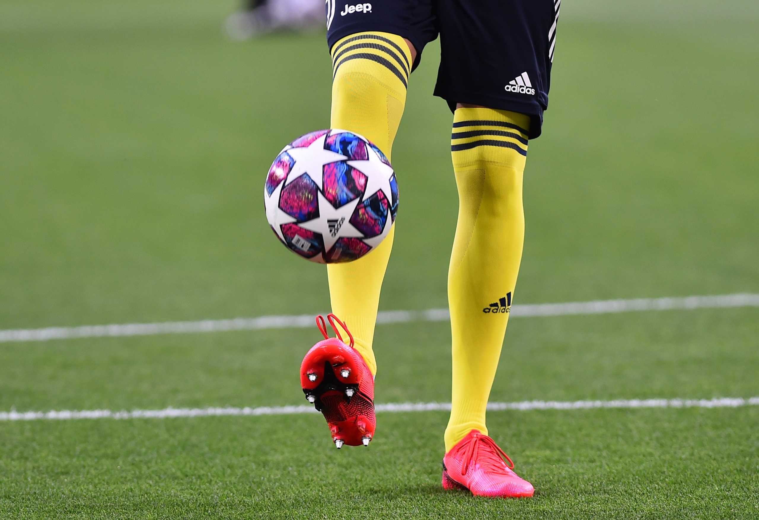 Soccer Football - Champions League - Round of 16 Second Leg - Juventus v Olympique Lyonnais - Allianz Stadium, Turin, Italy - August 7, 2020  Juventus player warms up before the match, as play resumes behind closed doors following the outbreak of the coronavirus disease (COVID-19) REUTERS
