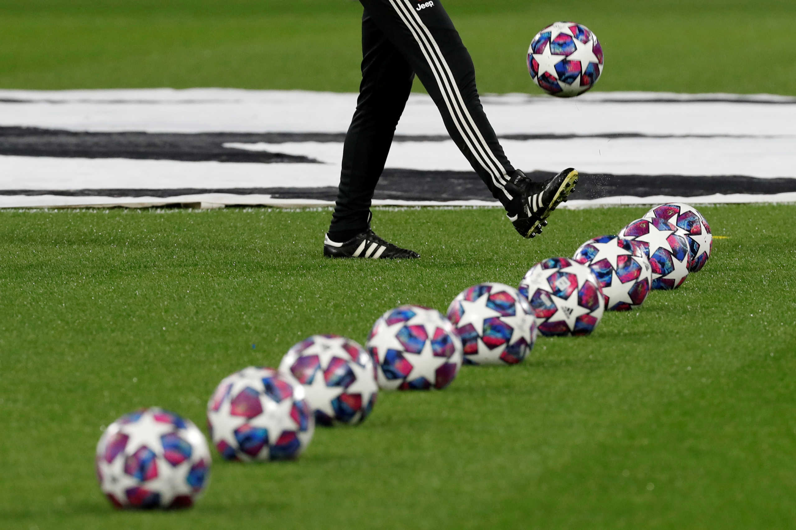 FILE PHOTO: Soccer Football - Champions League - Round of 16 First Leg - Olympique Lyonnais v Juventus - Groupama Stadium, Lyon, France - February 26, 2020  General view of match balls on the pitch before the match   REUTERS