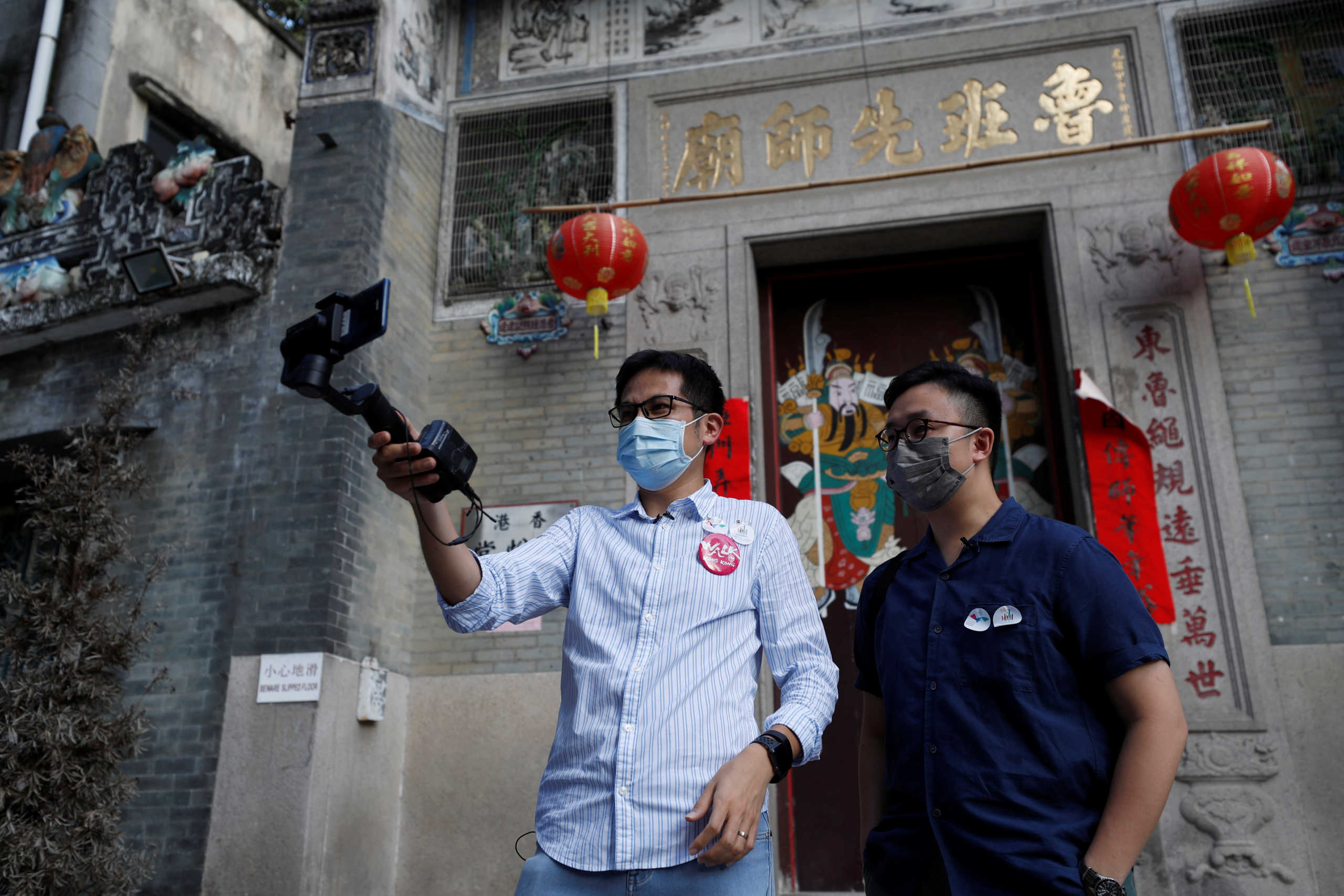 Paul Chan, tour guide and CEO of Walk in Hong Kong, and Charles Lai,  architect, speak during a live streamed virtual tour, following the coronavirus disease (COVID-19) outbreak in Hong Kong, China August 16, 2020. Picture taken August 16, 2020. REUTERS