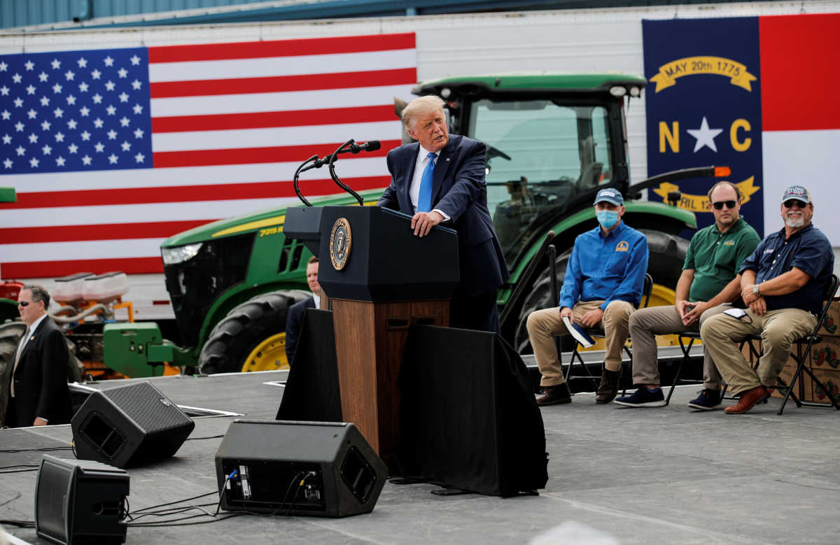 U.S. President Donald Trump arrives to deliver a speech at the Farmers to Families Food Box Program location at Flavor First Growers and Packers in Mills River, North Carolina, U.S., August 24, 2020. REUTERS