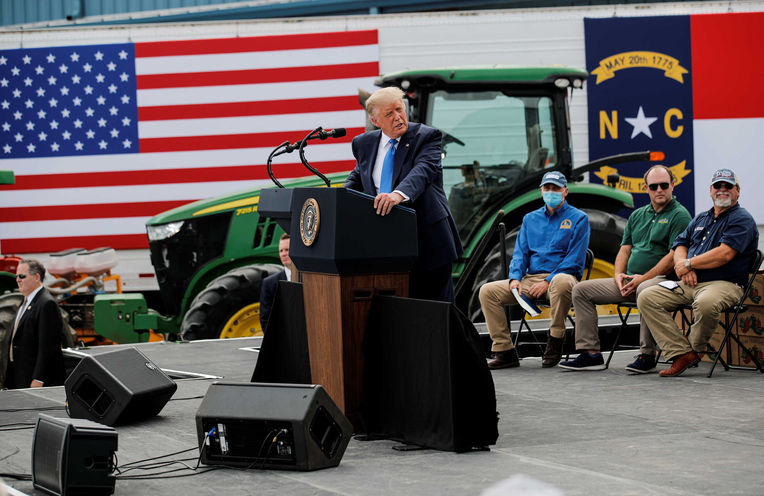 U.S. President Donald Trump arrives to deliver a speech at the Farmers to Families Food Box Program location at Flavor First Growers and Packers in Mills River, North Carolina, U.S., August 24, 2020. REUTERS
