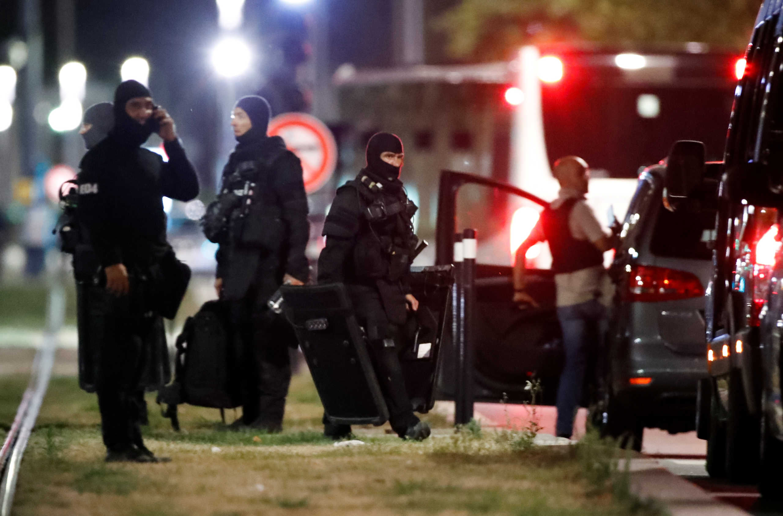 Police officers secure the area near the bank where an armed man held hostages, in Le Havre, France, August 6, 2020. REUTERS