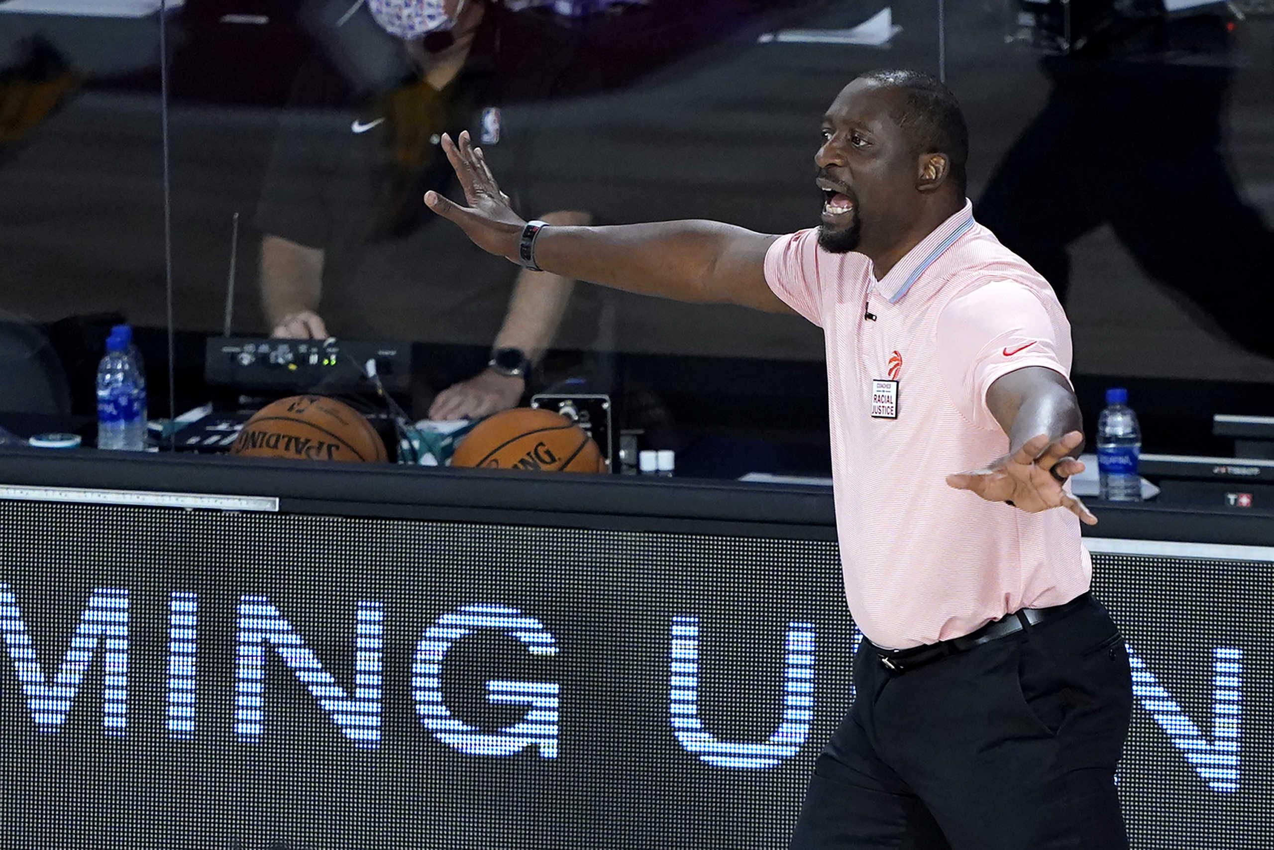 Aug 12, 2020; Lake Buena Vista, Florida, USA;   Toronto Raptors assistant coach Adrian Griffin reacts during the first half of an NBA basketball game while leading the team after head coach Nick Nurse stepped down for a the night to let Griffin coach against the Philadelphia 76ers Wednesday, Aug. 12, 2020 in Lake Buena Vista, Fla.  Mandatory Credit: Ashley Landis