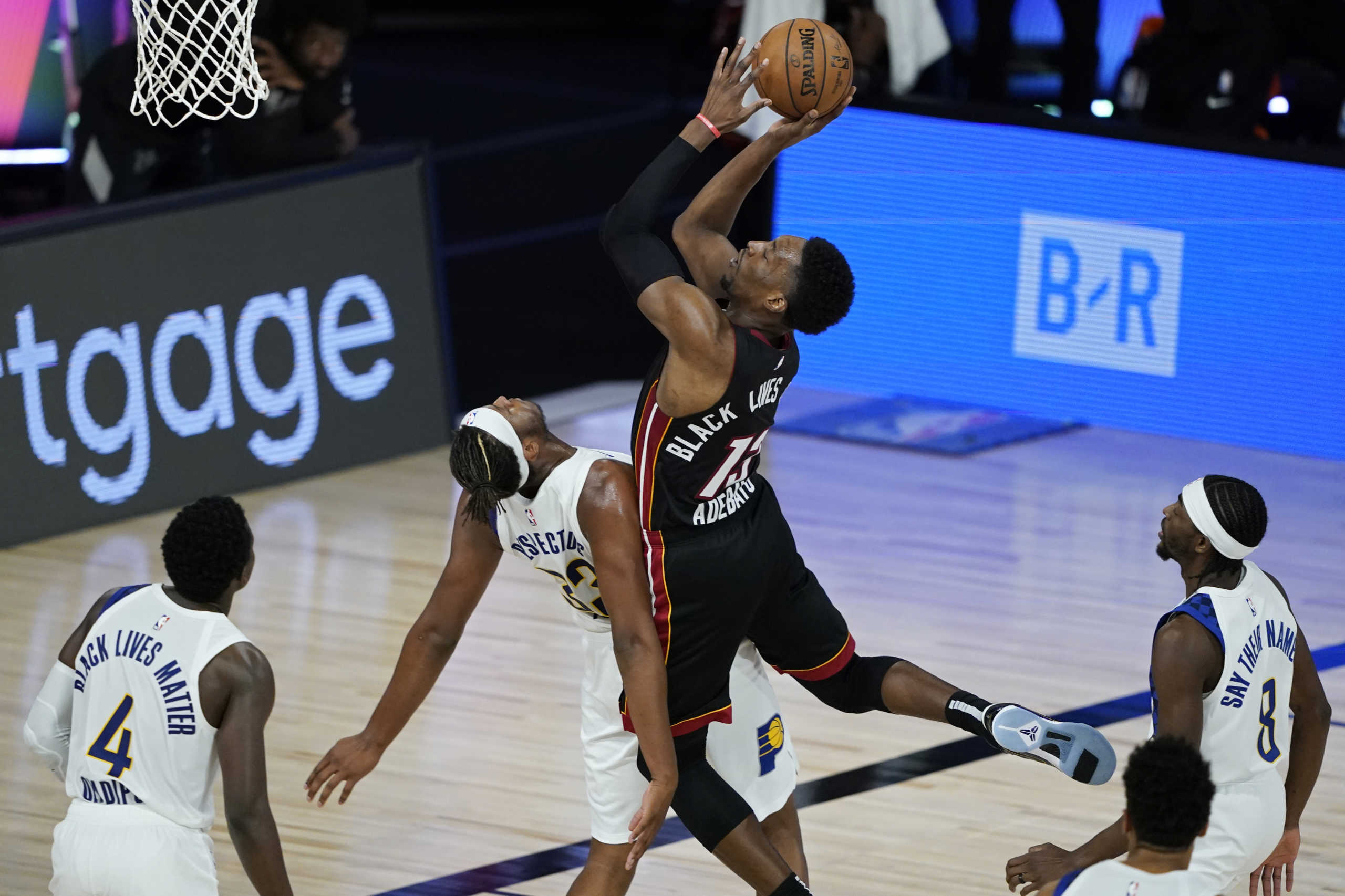 Aug 24, 2020; Lake Buena Vista, Florida, USA;Miami Heat's Bam Adebayo (13) shoots over Indiana Pacers' Myles Turner (33) during the second half in game four of the first round of the 2020 NBA Playoffs at The Field House. Mandatory Credit: Ashley Landis
