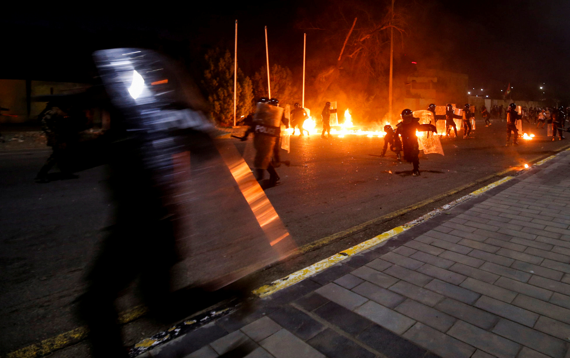 Iraqi demonstrators clash with Iraqi security forces during the ongoing anti-government protests in Basra,Iraq.August 21, 2020. REUTERS
