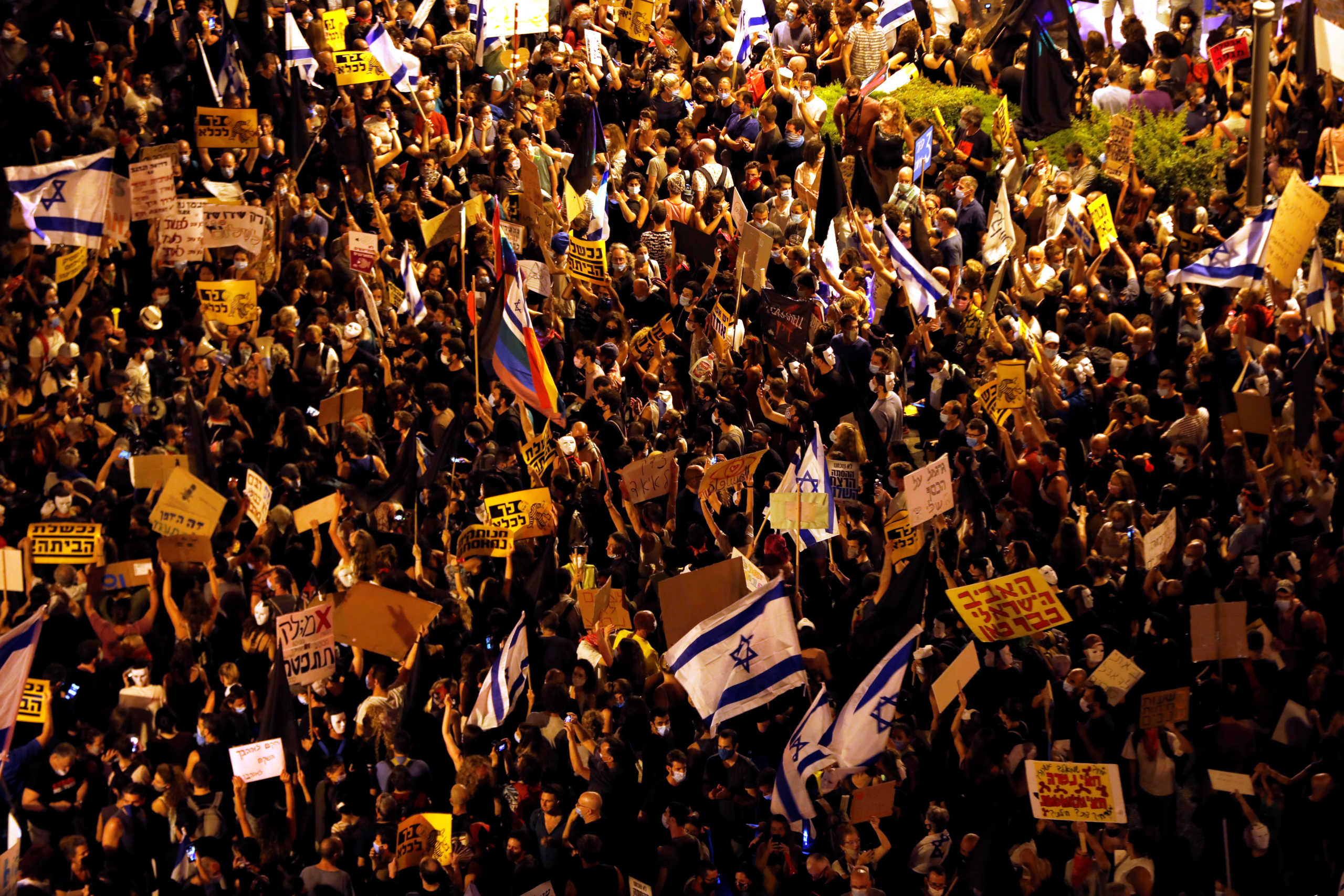 People take part in a demonstration against Israeli Prime Minister Benjamin Netanyahu's alleged corruption and his government's way of handling the coronavirus disease (COVID-19) crisis, near Netanyahu's residence in Jerusalem August 1, 2020. REUTERS