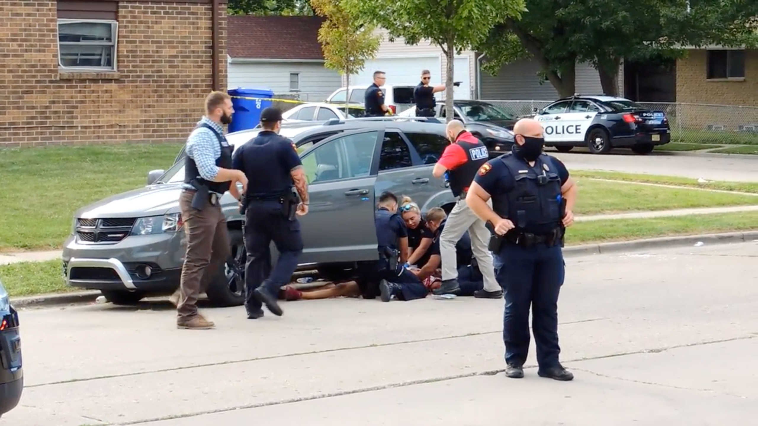 Jacob Blake lies on the street after he got shot following a police shooting in Kenosha, Wisconsin, U.S., August 23, 2020 in this screen grab obtained from a social media video. Incident Response