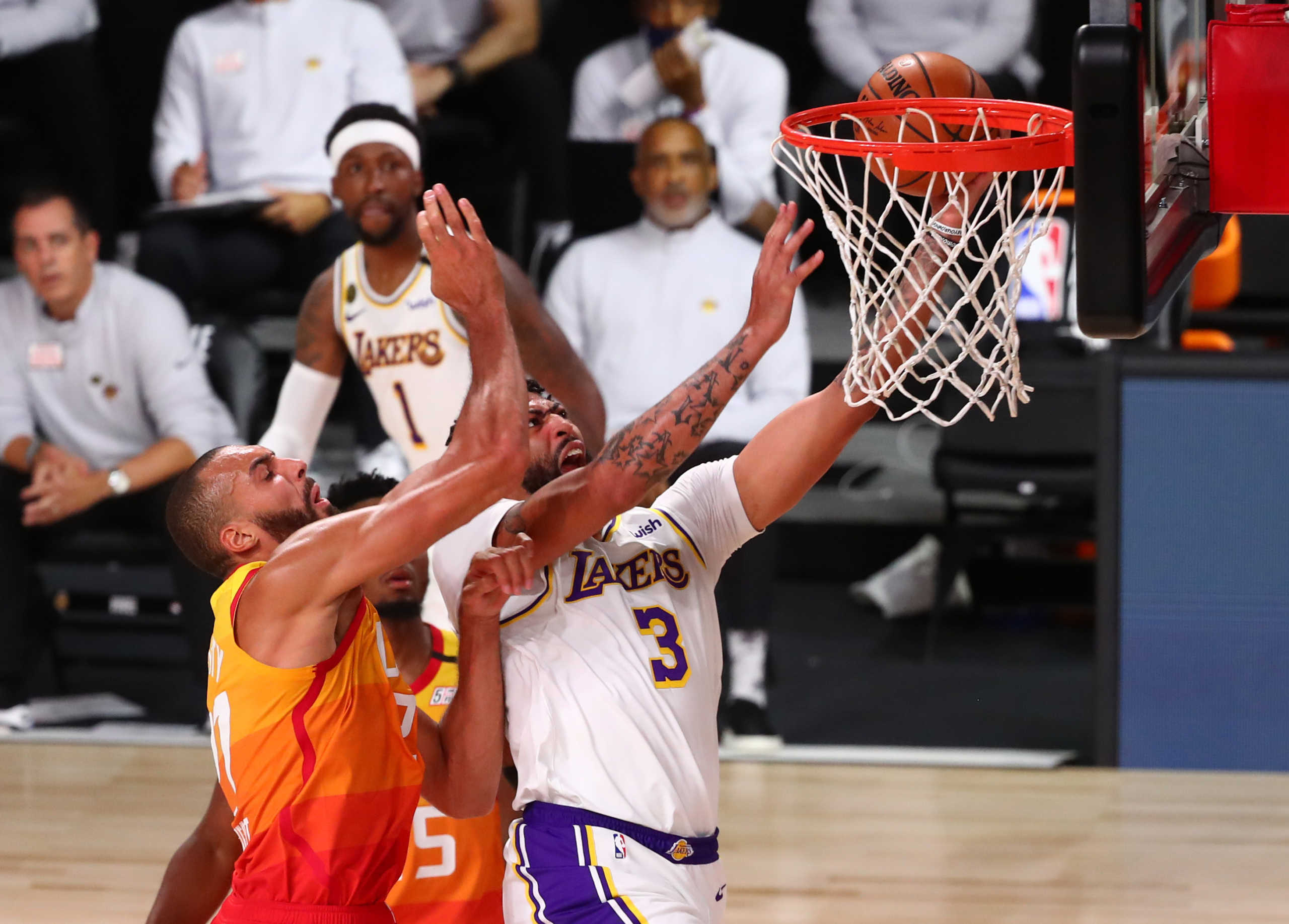 Aug 3, 2020; Lake Buena Vista, Florida, USA; Los Angeles Lakers forward Anthony Davis (3) is fouled by Utah Jazz center Rudy Gobert (27) during the first half of a NBA game at The Arena at the ESPN Wide World of Sports Complex. Mandatory Credit: Kim Klement-USA TODAY Sports