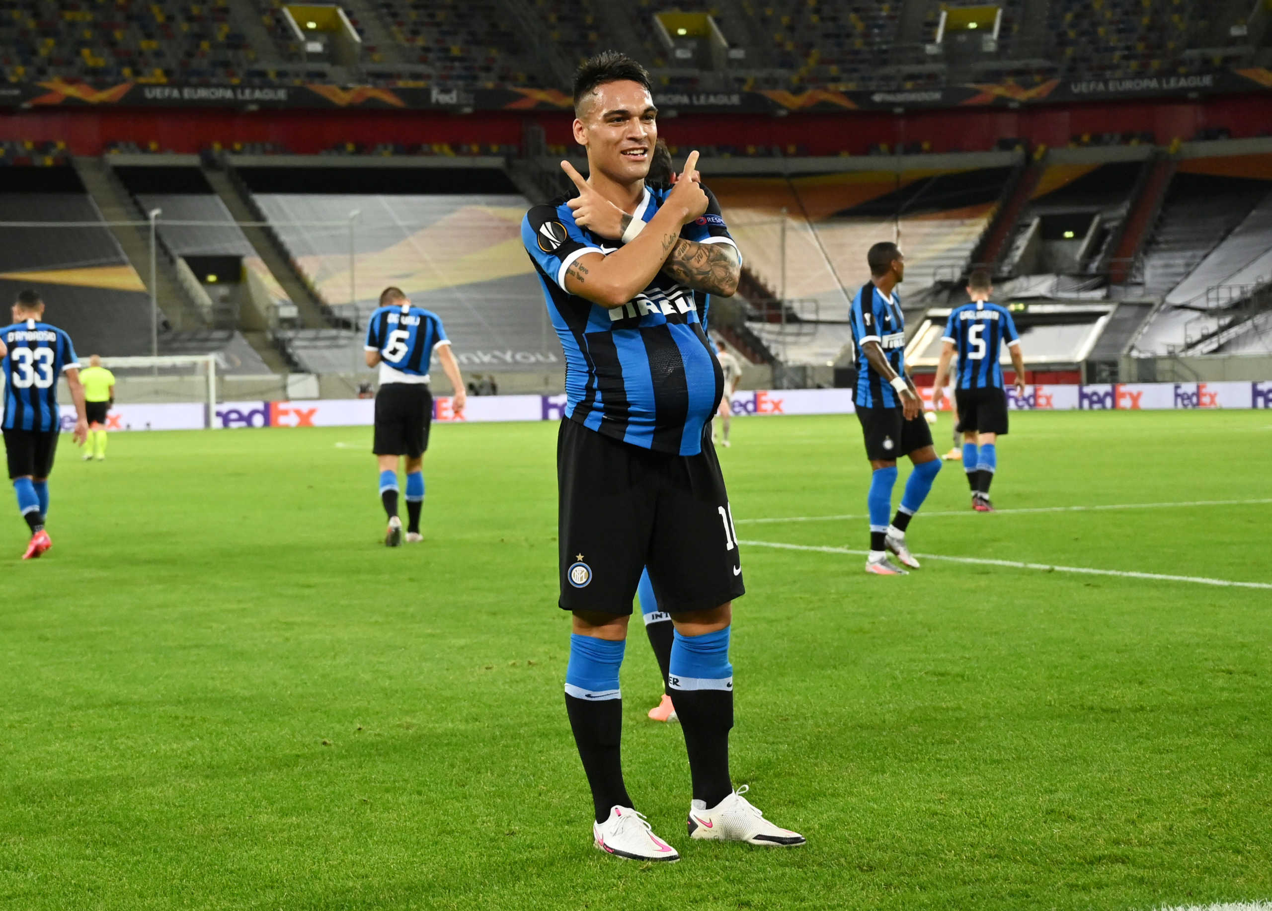 Soccer Football - Europa League - Semi Final - Inter Milan v Shakhtar Donetsk - Merkur Spiel-Arena, Dusseldorf, Germany - August 17, 2020 Inter Milan's Lautaro Martinez celebrates scoring their first goal, as play resumes behind closed doors following the outbreak of the coronavirus disease (COVID-19)  Sascha Steinbach