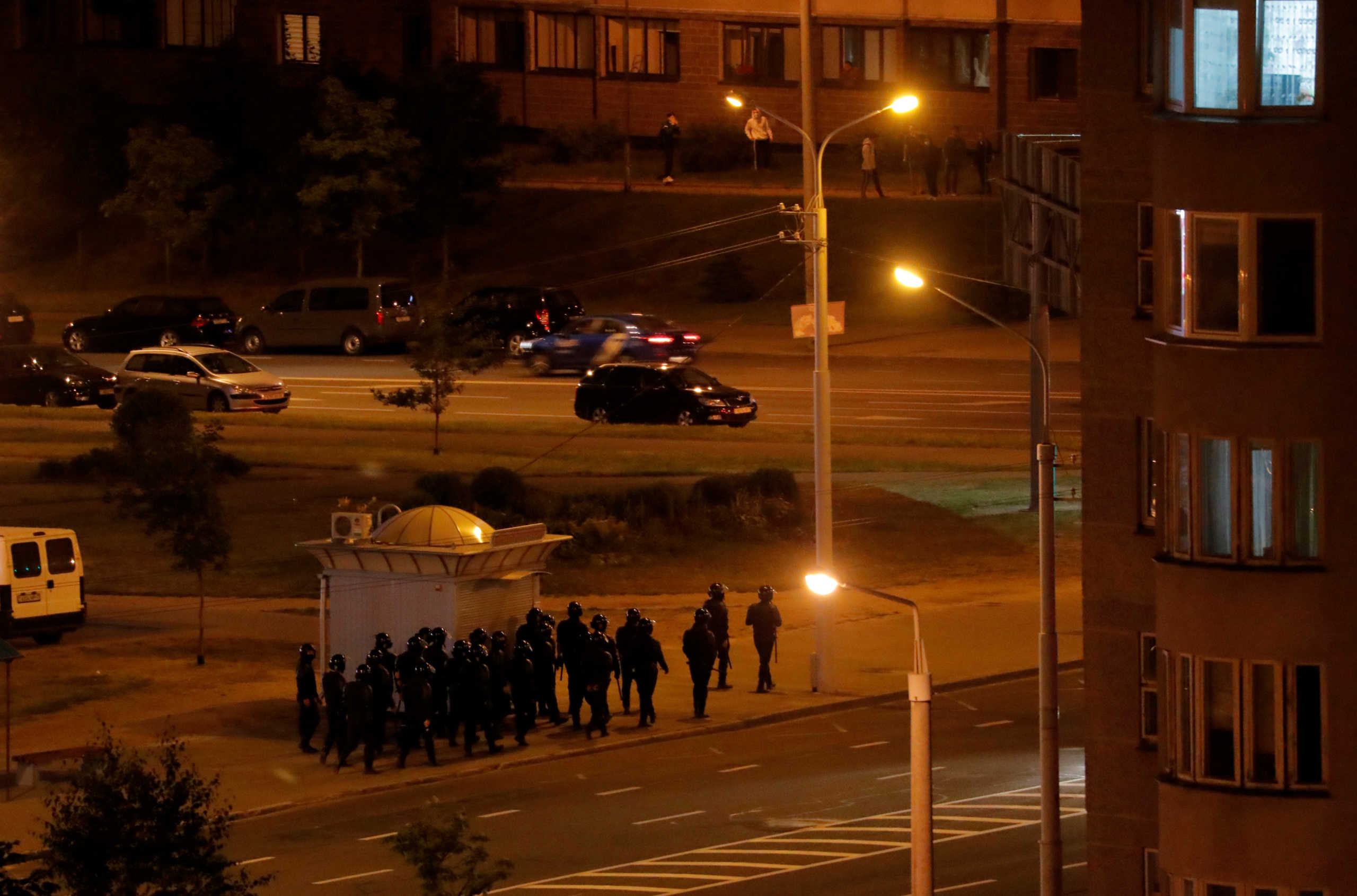 Belarusian law enforcement officers patrol the streets as people protest against the presidential election results, in Minsk, Belarus August 12, 2020. REUTERS