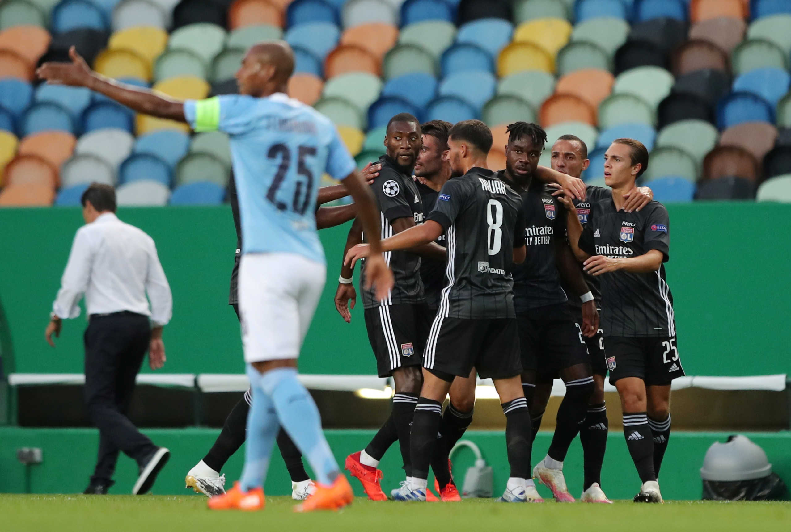 Soccer Football - Champions League Quarter Final - Manchester City v Olympique Lyonnais - Jose Alvalade Stadium, Lisbon, Portugal - August 15, 2020  Olympique Lyonnais' Maxwel Cornet celebrates scoring their first goal with teammates, as play resumes behind closed doors following the outbreak of the coronavirus disease (COVID-19)  Miguel A. Lopes