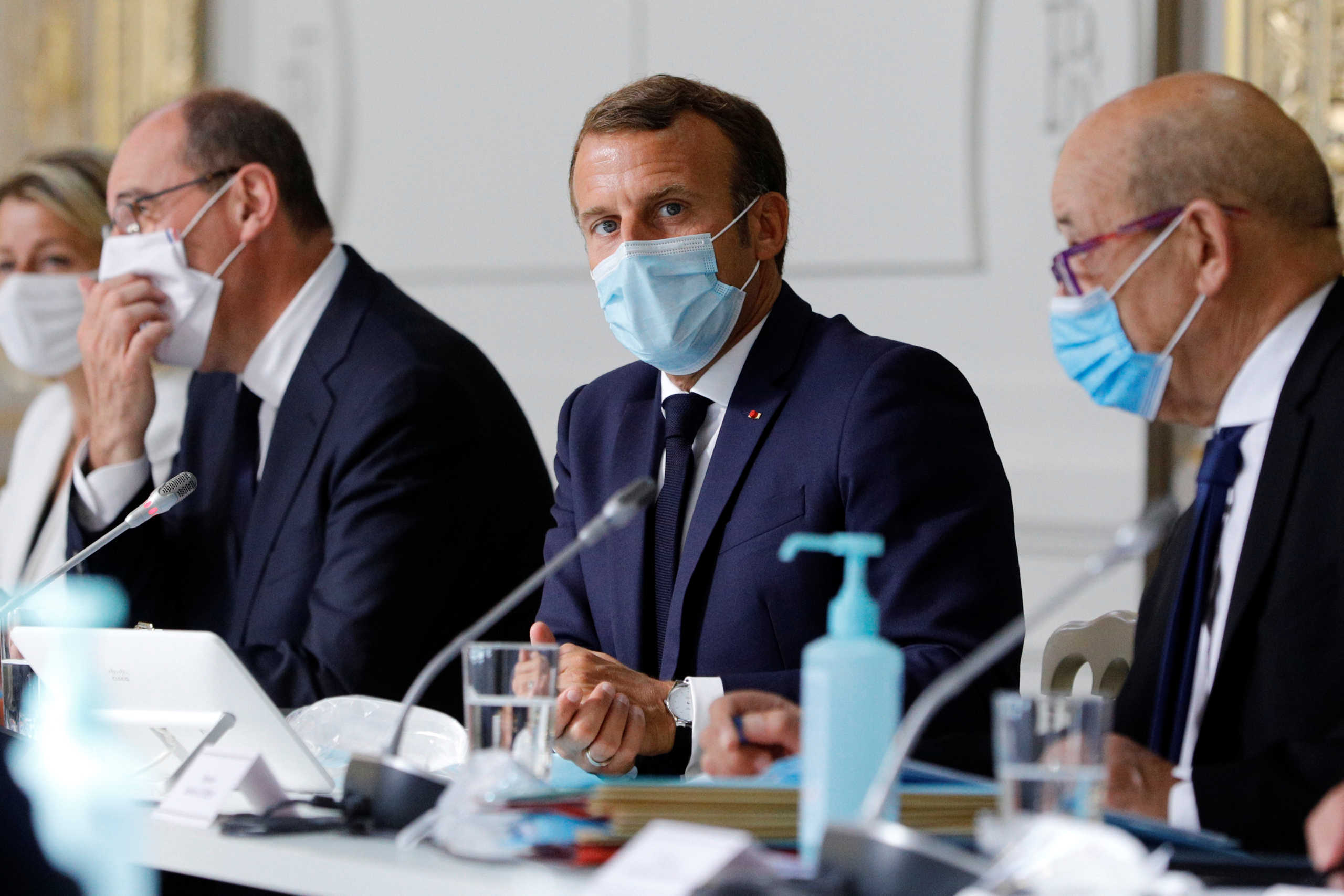 French President Emmanuel Macron chairs a weekly cabinet meeting with Prime Minister Jean Castex and Foreign Minister Jean-Yves le Drian, at the Elysee Palace in Paris, France August 26, 2020. Kamil Zihnioglu