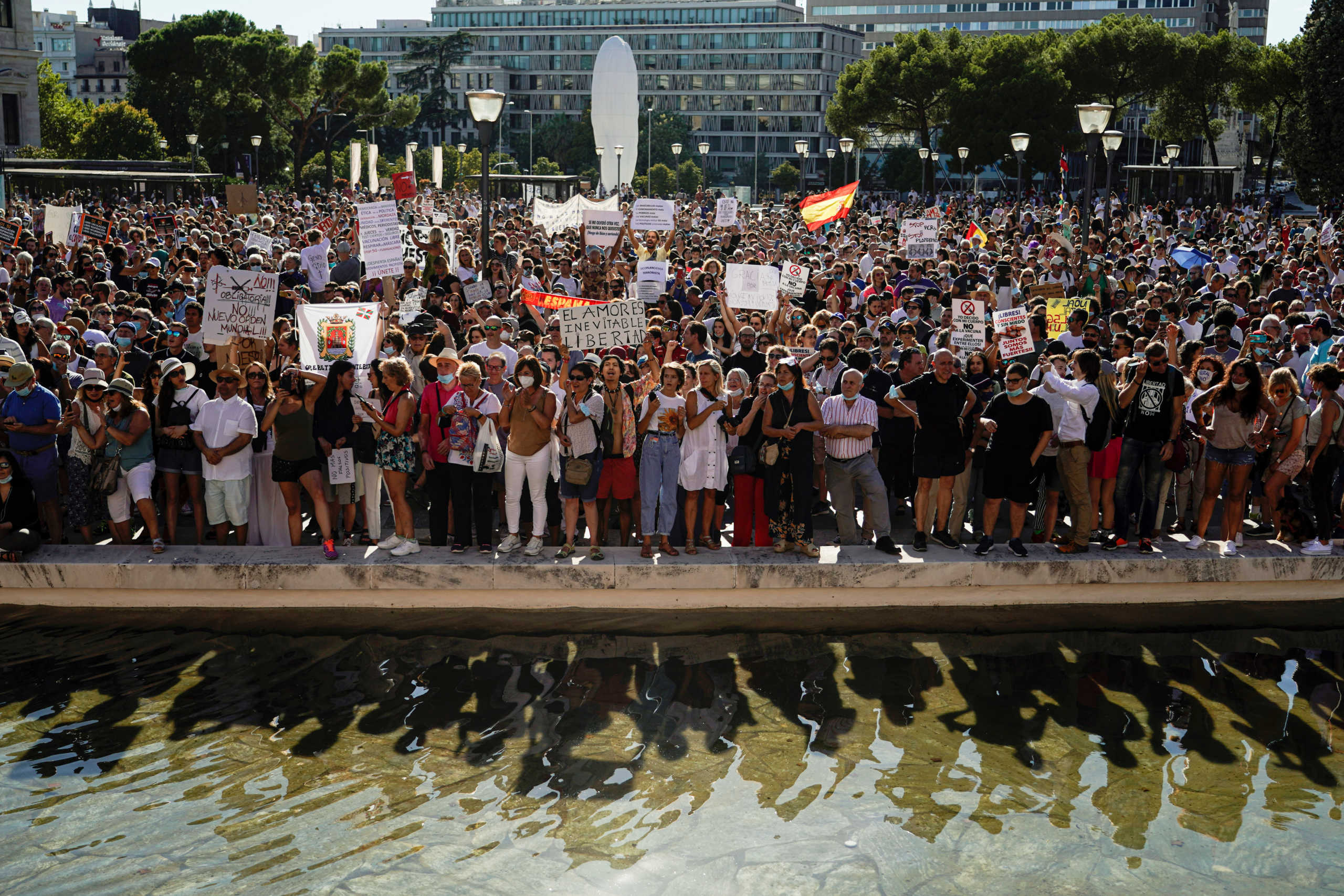 People take part in a protest against the use of protective masks during the coronavirus disease (COVID-19) pandemic, in Madrid, Spain August 16, 2020. REUTERS