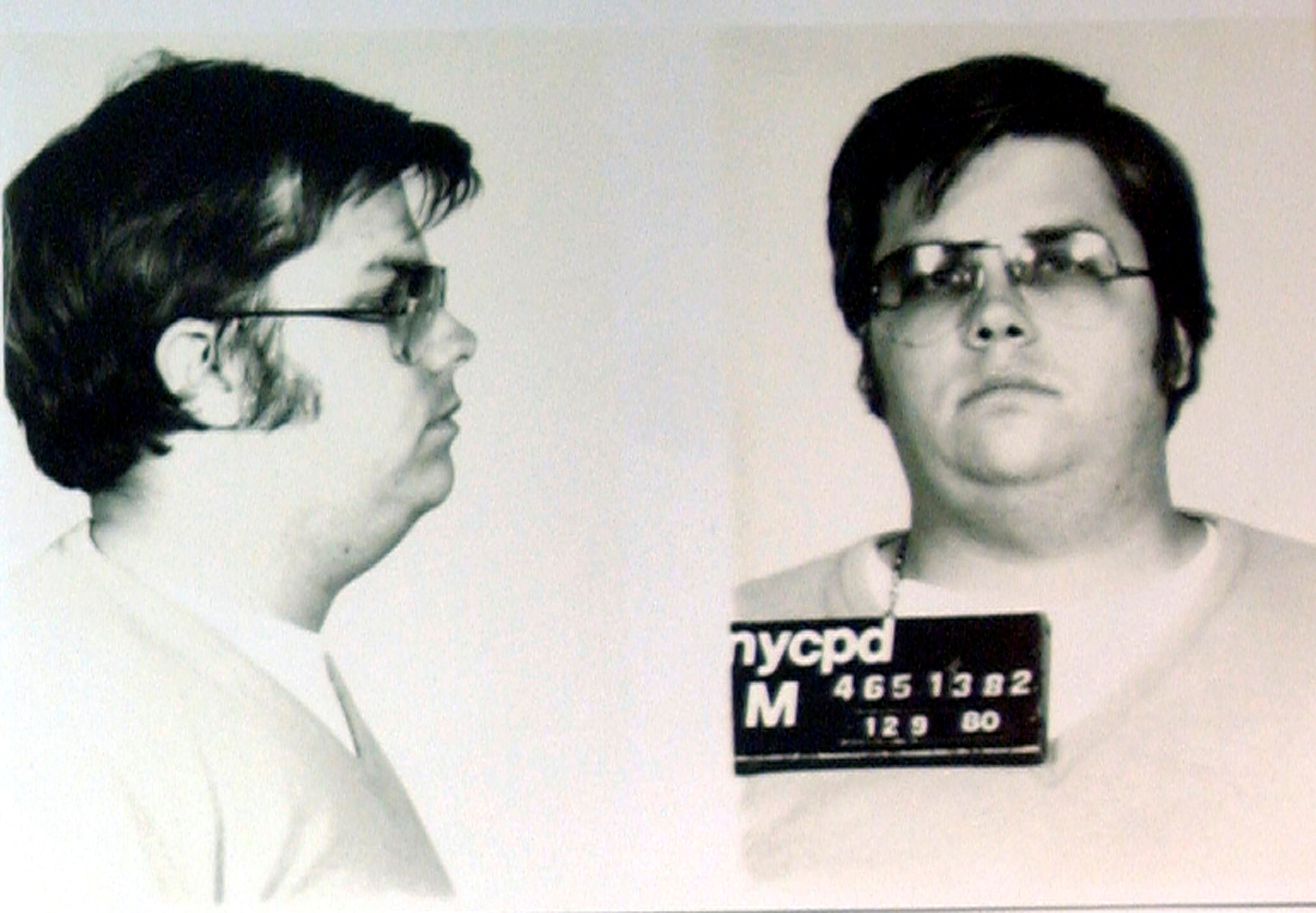 FILE PHOTO: A mug-shot of Mark David Chapman, who shot and killed John Lennon, is displayed on the 25th anniversary of Lennon's death at the NYPD in New York December 8, 2005. Chapman is currently imprisoned at Attica State Prison in New York, serving a 20-year-to-life sentence after pleading guilty to 2nd degree murder. REUTERS