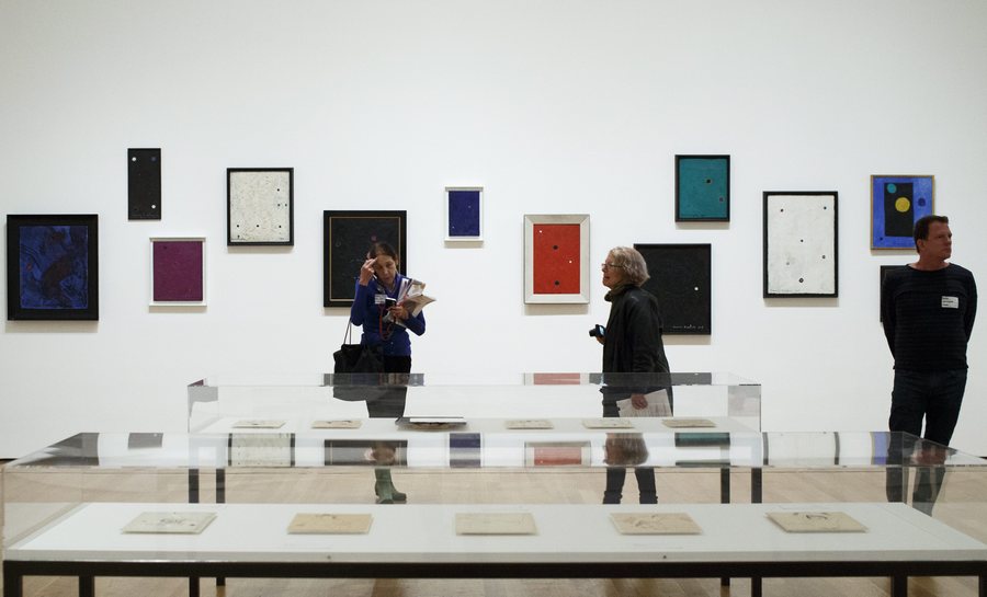 epa05632693 People look at works of art in the upcoming exhibit 'Francis Picabia: Our Heads Are Round so Our Thoughts Can Change Direction' at the Museum of Modern Art in New York, New York, USA, 15 November 2016. The exhibit, which runs from 21 November 2016 until 19 March 2017, is made up of work in various mediums by French artist Picabia (1879-1953) from throughout his career.  EPA