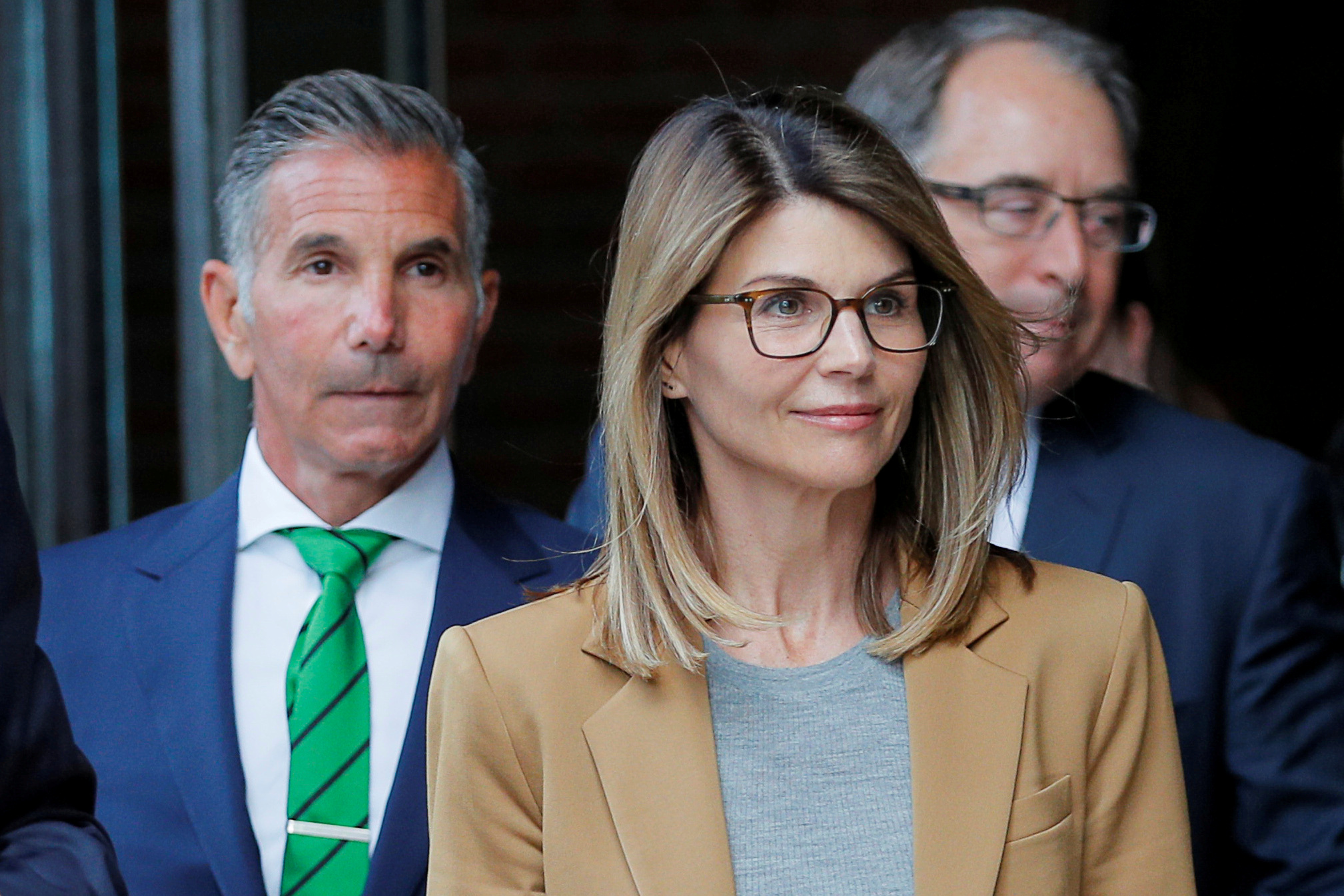 FILE PHOTO: Actor Lori Loughlin, and her husband, fashion designer Mossimo Giannulli, leave the federal courthouse after facing charges in a nationwide college admissions cheating scheme, in Boston, Massachusetts, U.S., April 3, 2019. REUTERS