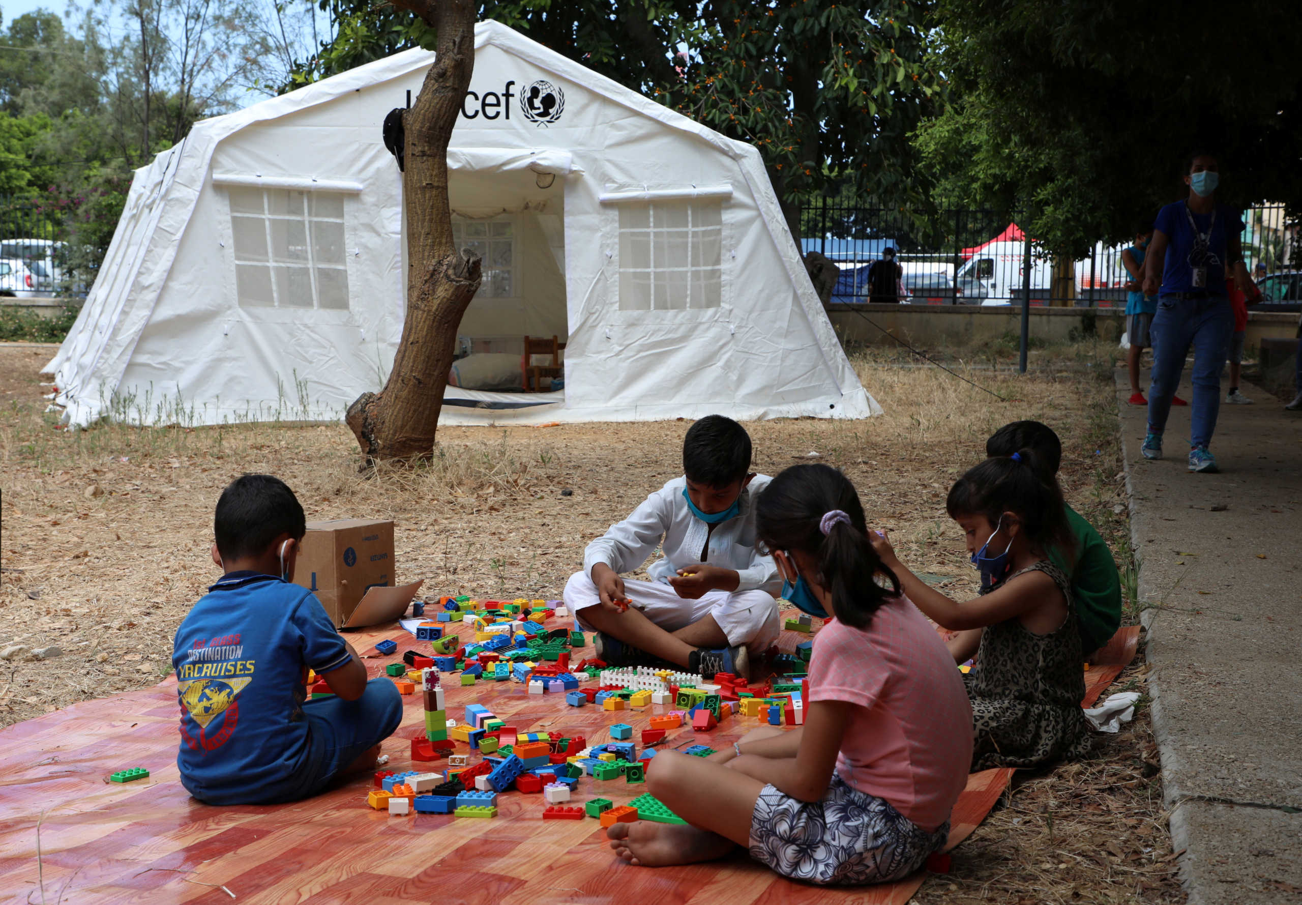 Children play outisde a UNICEF tent put in place to provide psychosocial support to people affected by a massive explosion in Beirut's port area, Lebanon August 20, 2020. Picture taken August 20, 2020. REUTERS