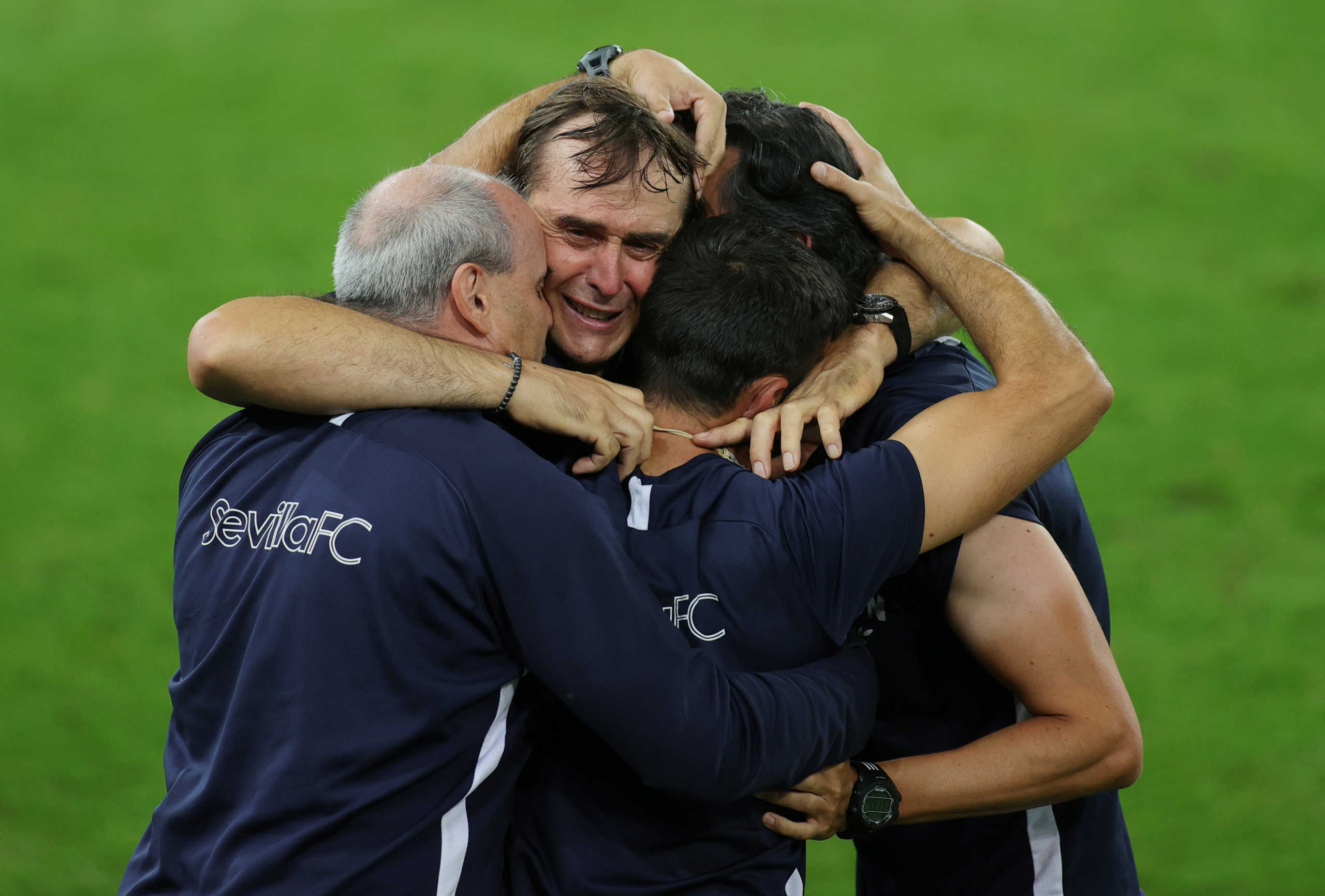 Soccer Football - Europa League - Final - Sevilla v Inter Milan - RheinEnergieStadion, Cologne, Germany - August 21, 2020  Sevilla coach Julen Lopetegui celebrates winning the Europa League Final with coaching staff, as play resumes behind closed doors following the outbreak of the coronavirus disease (COVID-19)  Friedemann Vogel