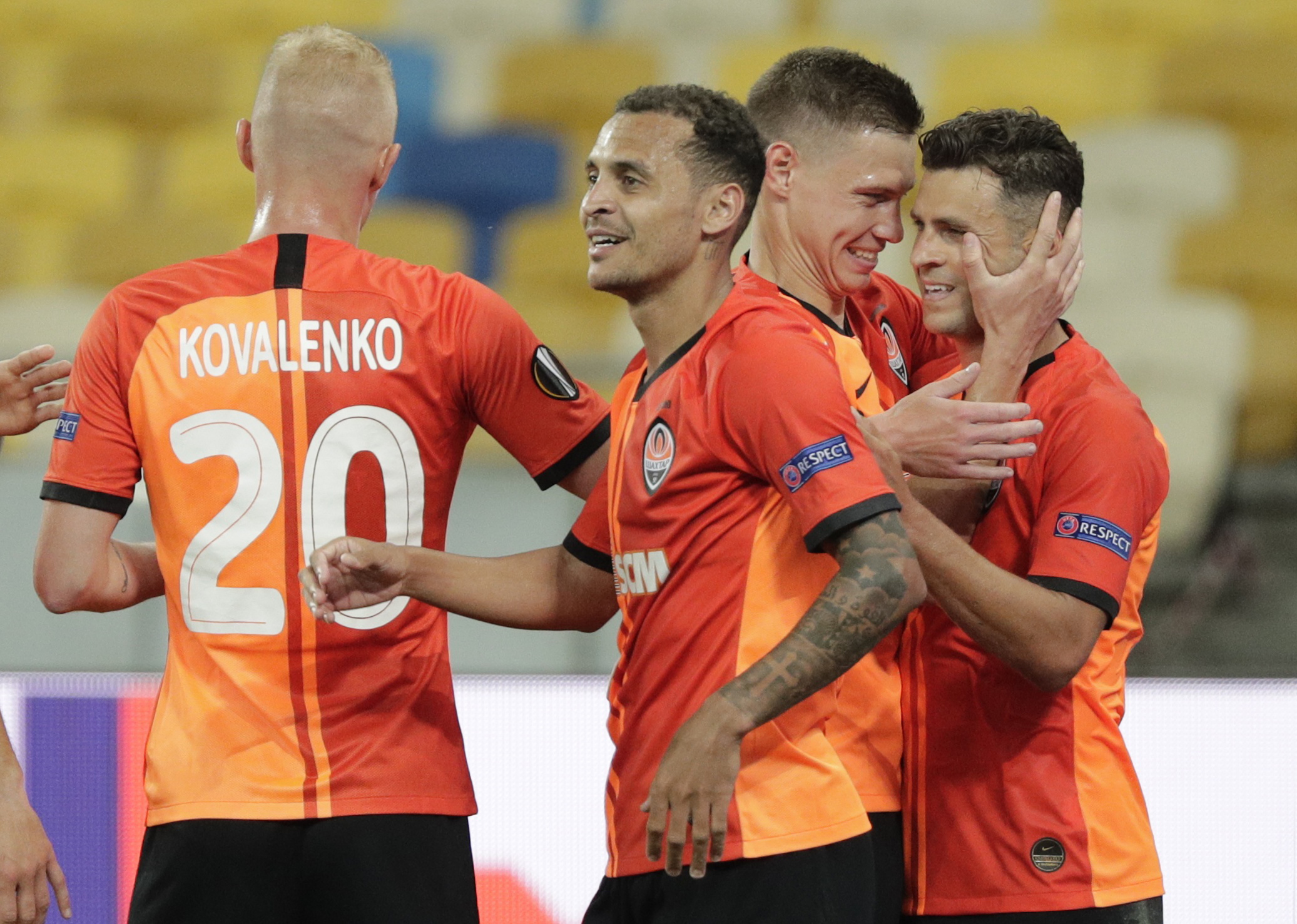 Soccer Football - Europa League - Round of 16 Second Leg - Shakhtar Donetsk v VfL Wolfsburg - NSC Olimpiyskiy, Kyiv, Ukraine - August 5, 2020 Shakhtar Donetsk's Junior Moraes celebrates scoring their first goal with Manor Solomon, as play resumes behind closed doors following the outbreak of the coronavirus disease (COVID-19) REUTERS