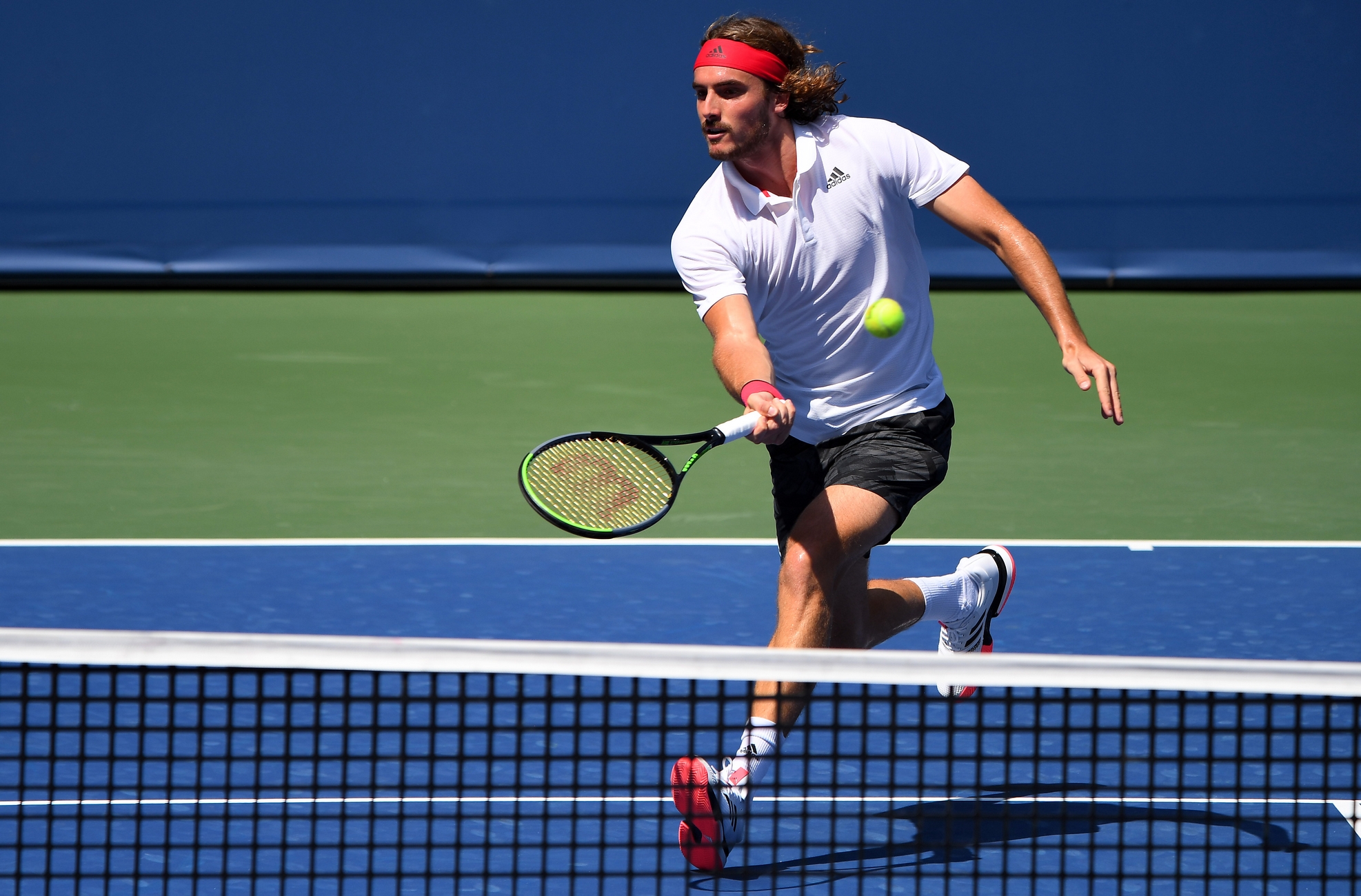 Aug 28, 2020; Flushing Meadows, New York, USA; Stefanos Tsitsipas (GRE) hits the ball against Milos Raonic (CAN) during the Western & Southern Open at the USTA Billie Jean King National Tennis Center. Mandatory Credit: Robert Deutsch-USA TODAY Sports