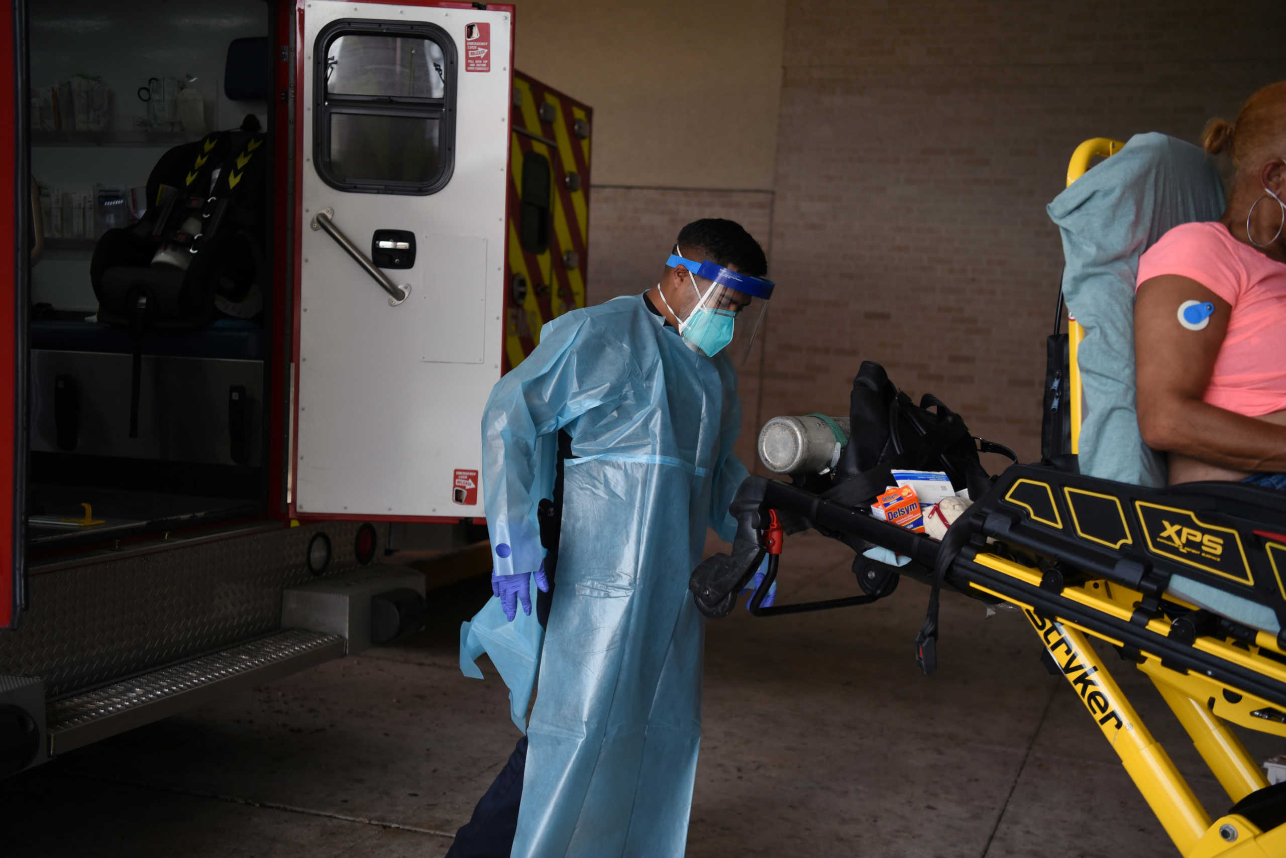 Pedro Hinojosa tends to a non-COVID-19 patient while wearing protective equipment against the spread of the coronavirus disease (COVID-19) in Houston, Texas, U.S., August 23, 2020.  REUTERS