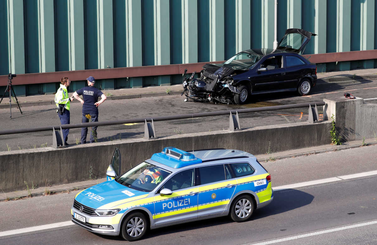 Police officers investigate the scene of a series of allegedly deliberate car crashes on highway A100 in Berlin, Germany, August 19, 2020. REUTERS