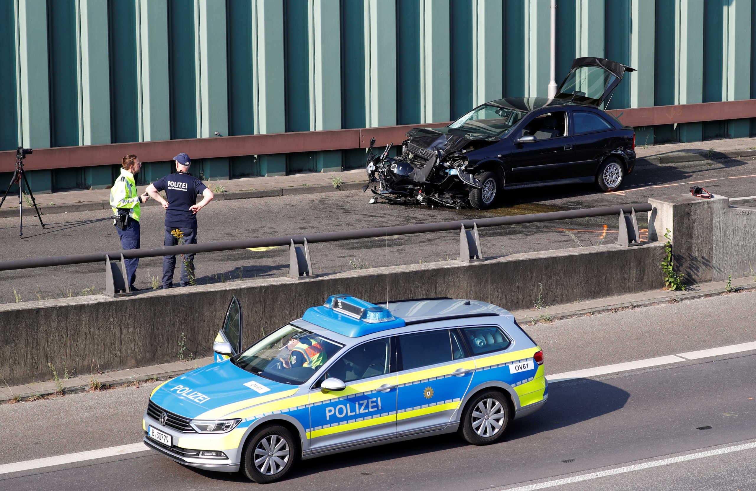 Police officers investigate the scene of a series of allegedly deliberate car crashes on highway A100 in Berlin, Germany, August 19, 2020. REUTERS