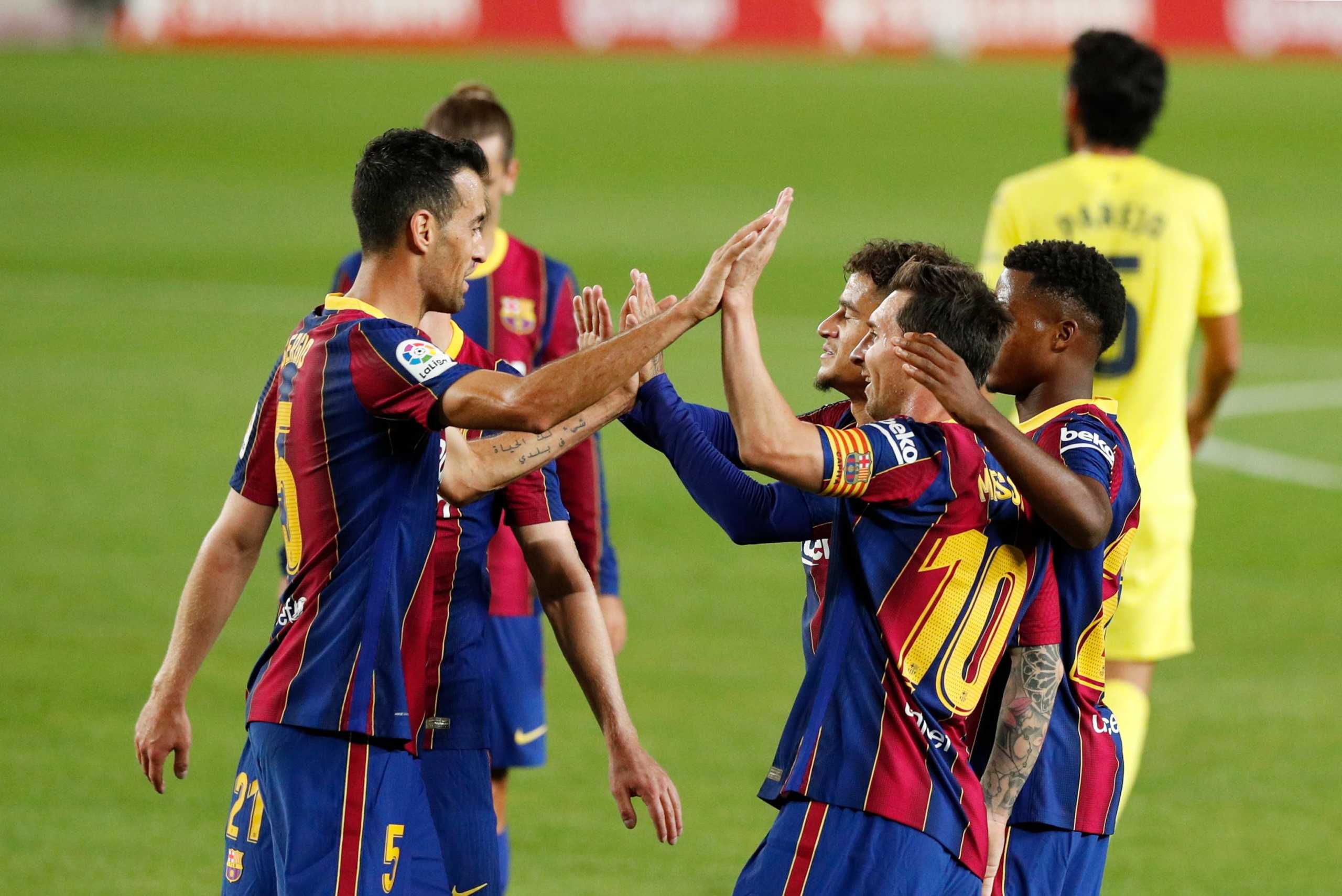 Soccer Football - La Liga Santander - FC Barcelona v Villarreal - Camp Nou, Barcelona, Spain - September 27, 2020 Barcelona players celebrate their fourth goal which is an own goal scored by Villarreal's Pau Francisco Torres REUTERS