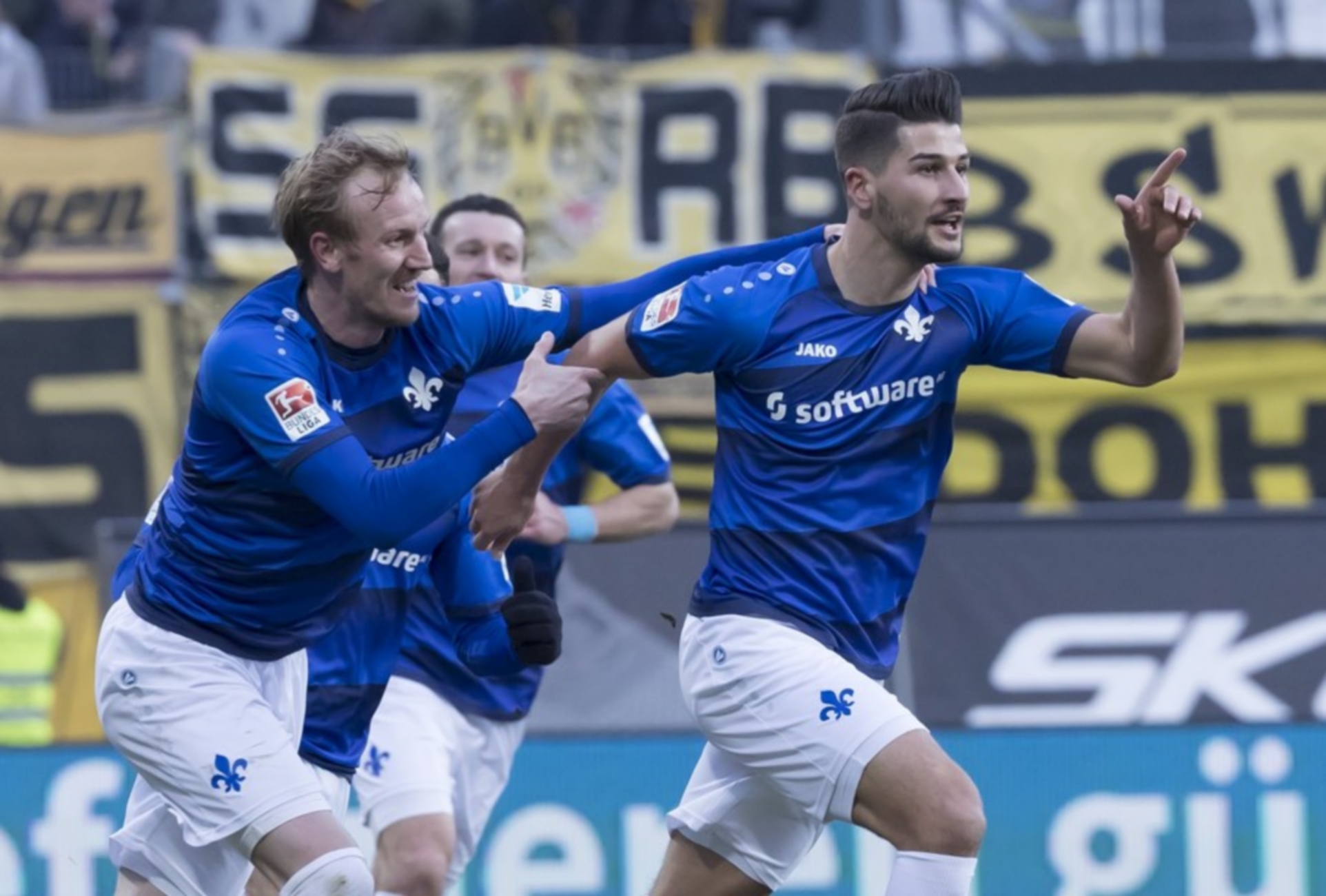 epa05785546 Darmstadt's Antonio-Mirko Colak (R) celebrates after scoring the 2-1 lead with teammates during the German Bundesliga soccer match between SV Darmstadt 98 and Borussia Dortmund in Darmstadt, Germany, 11 February 2017.  EPA