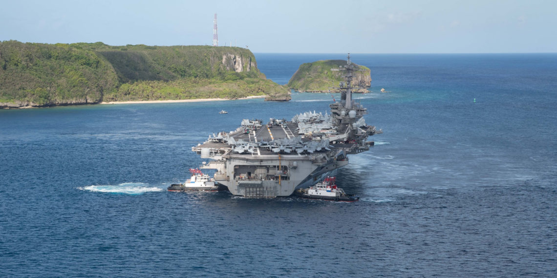 The U.S. Navy aircraft carrier USS Theodore Roosevelt departs following an extended visit in the midst of a coronavirus disease (COVID-19) outbreak, from Apra Harbor, Guam May 21, 2020. Picture taken May 21, 2020. U.S. Navy