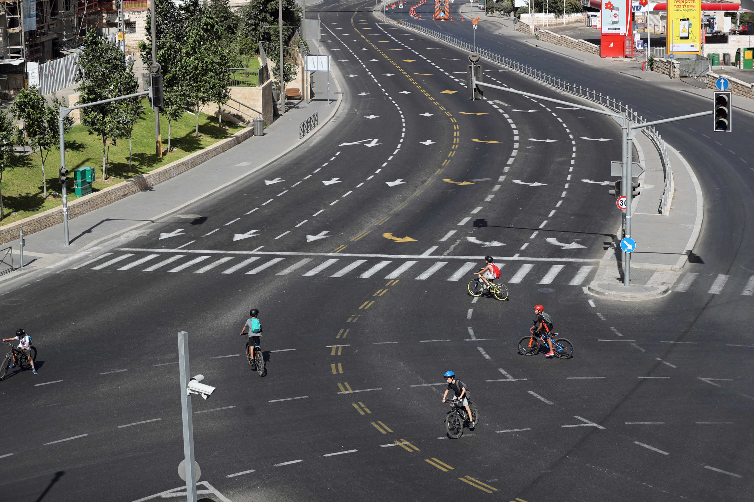 Children ride bicycles on a street on Yom Kippur, the Jewish day of atonement and the holiest day in the Jewish calendar, as Israel imposes a second nationwide coronavirus disease (COVID-19) lockdown amid a rise in infections, in Jerusalem September 28, 2020. REUTERS
