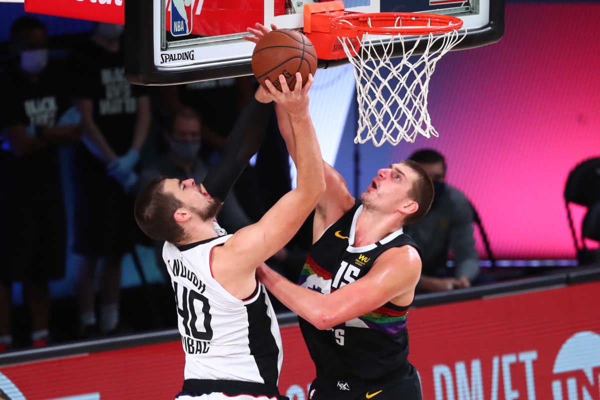 Sep 9, 2020; Lake Buena Vista, Florida, USA; Denver Nuggets center Nikola Jokic (15) defends against LA Clippers center Ivica Zubac (40)  in the second half in game four of the second round of the 2020 NBA Playoffs at AdventHealth Arena. Mandatory Credit: Kim Klement-USA TODAY Sports