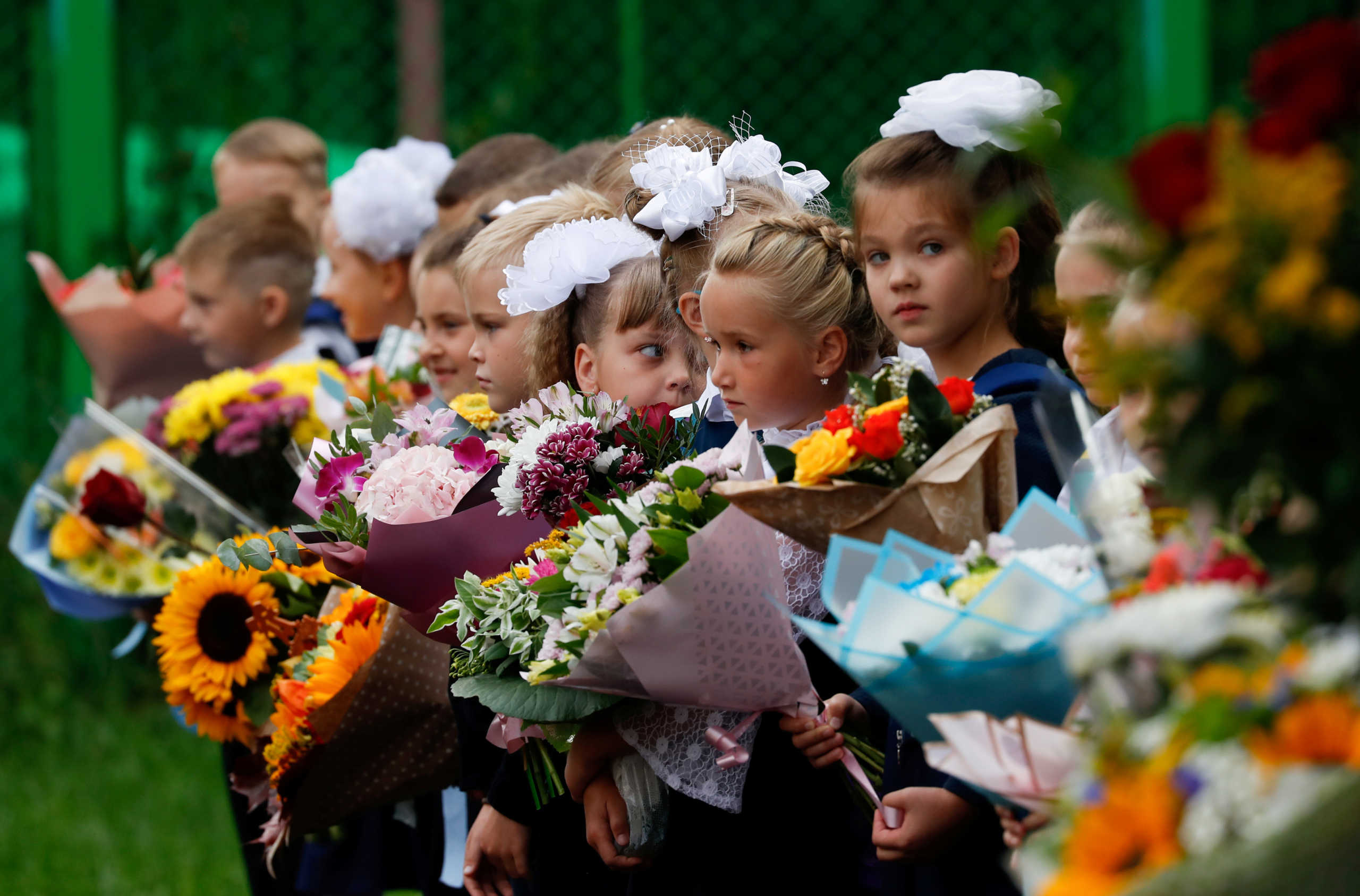 FILE PHOTO: First graders attend a ceremony marking the start of the new school year, as schools reopen after the summer break and the lockdown due to the outbreak of the coronavirus disease (COVID-19), in Moscow, Russia September 1, 2020. REUTERS