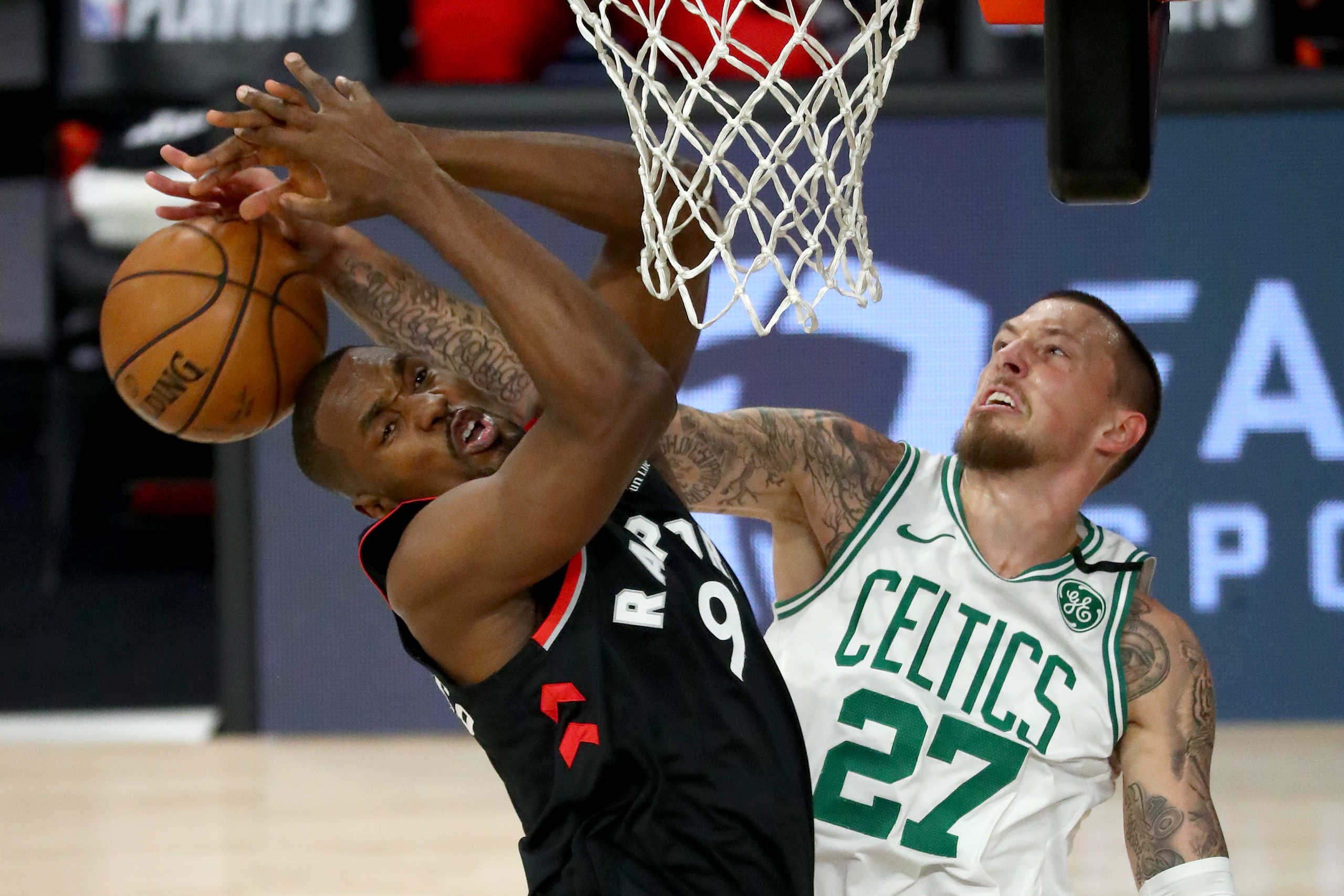 Sep 5, 2020; Lake Buena Vista, Florida, USA; Boston Celtics center Daniel Theis (27) blocks Toronto Raptors center Serge Ibaka (9) during the first half of game four in the second round of the 2020 NBA Playoffs at ESPN Wide World of Sports Complex. Mandatory Credit: Kim Klement-USA TODAY Sports