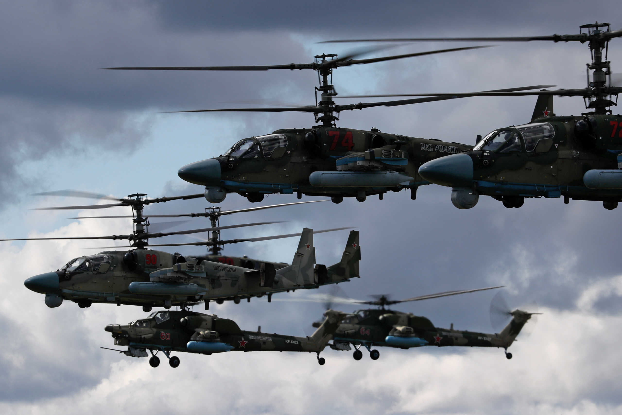 Russian Ka-52 and Mi-28N military helicopters fly during a rehearsal for the Victory Day air parade, which marks the 75th anniversary of the victory over Nazi Germany in World War Two, in Saint Petersburg, Russia May 7, 2020. REUTERS