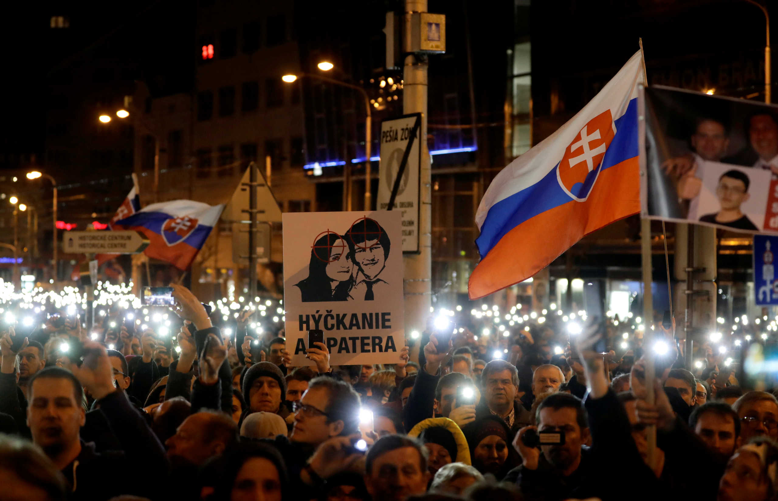 FILE PHOTO: Demonstrators take part in a protest rally marking the first anniversary of the murder of the investigative reporter Jan Kuciak and his fiancee Martina Kusnirova in Bratislava, Slovakia, February 21, 2019.  REUTERS