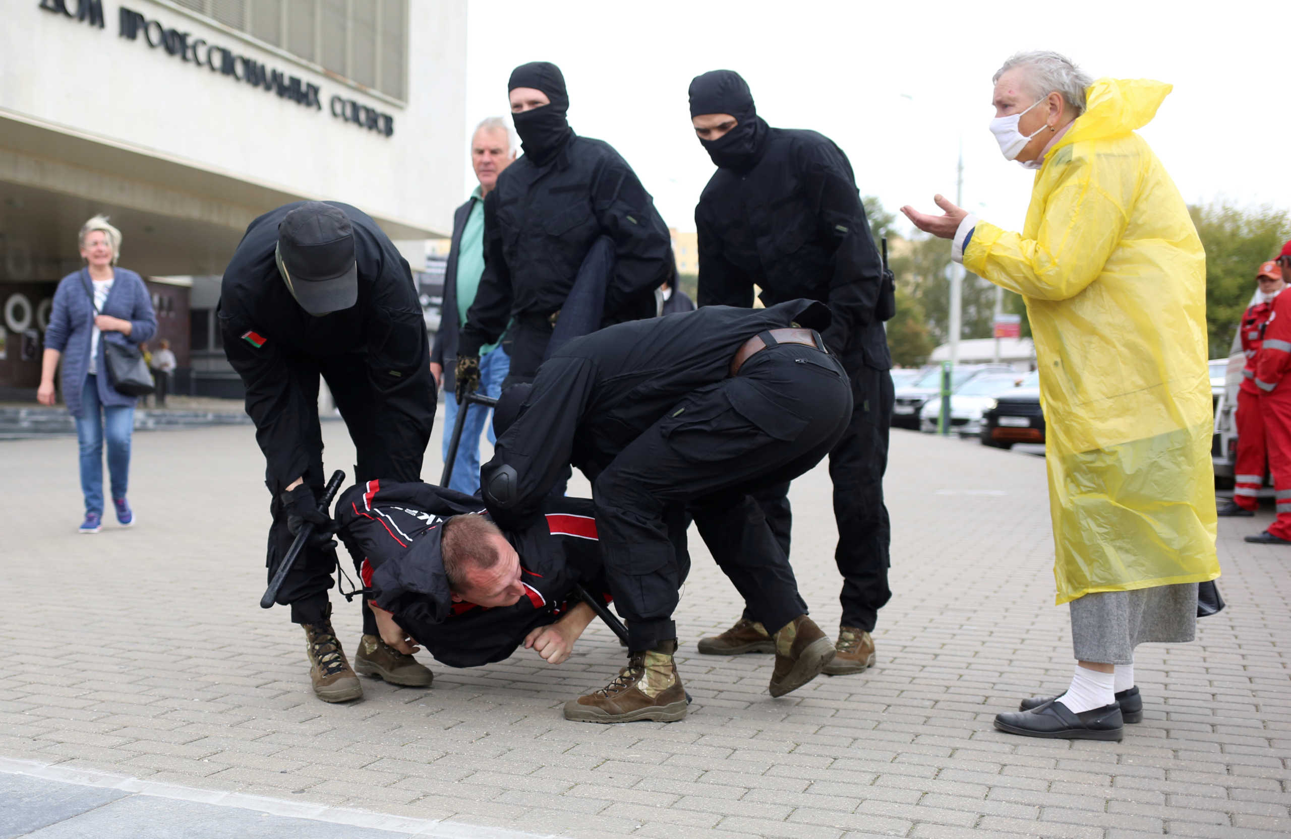 Unidentified people wearing masks, who are presumably Belarusian law enforcement members, detain a man during an opposition rally to reject the presidential election results and to protest against the inauguration of President Alexander Lukashenko in Minsk, Belarus September 27, 2020. REUTERS
