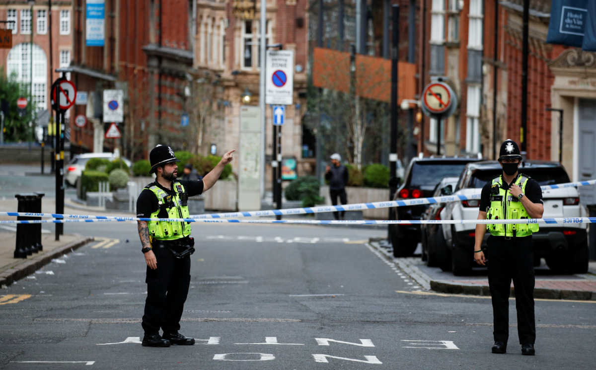 Police officers stand near the scene of reported stabbings in Birmingham, Britain, September 6, 2020.  REUTERS