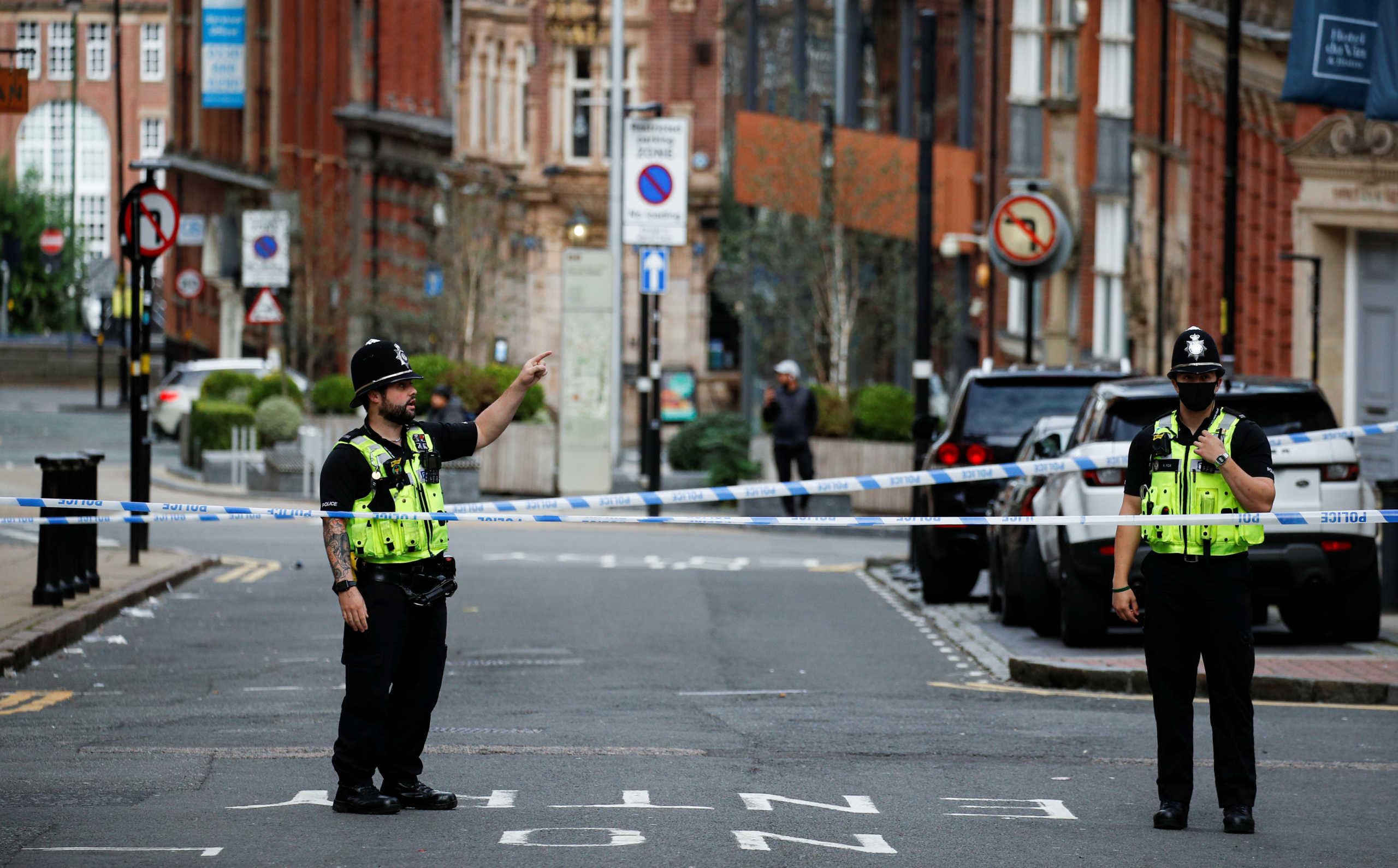 Police officers stand near the scene of reported stabbings in Birmingham, Britain, September 6, 2020.  REUTERS