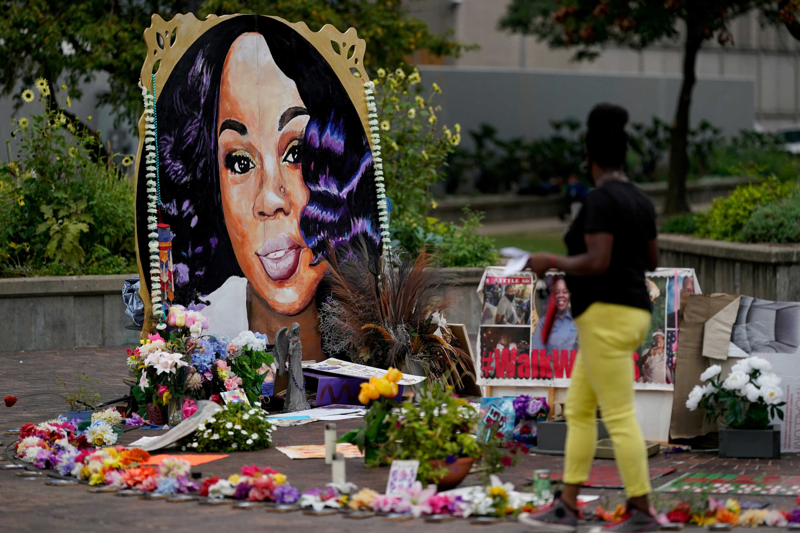 FILE PHOTO: A woman visits the memorial for Breonna Taylor in Louisville, Kentucky, U.S., September 11, 2020.  REUTERS