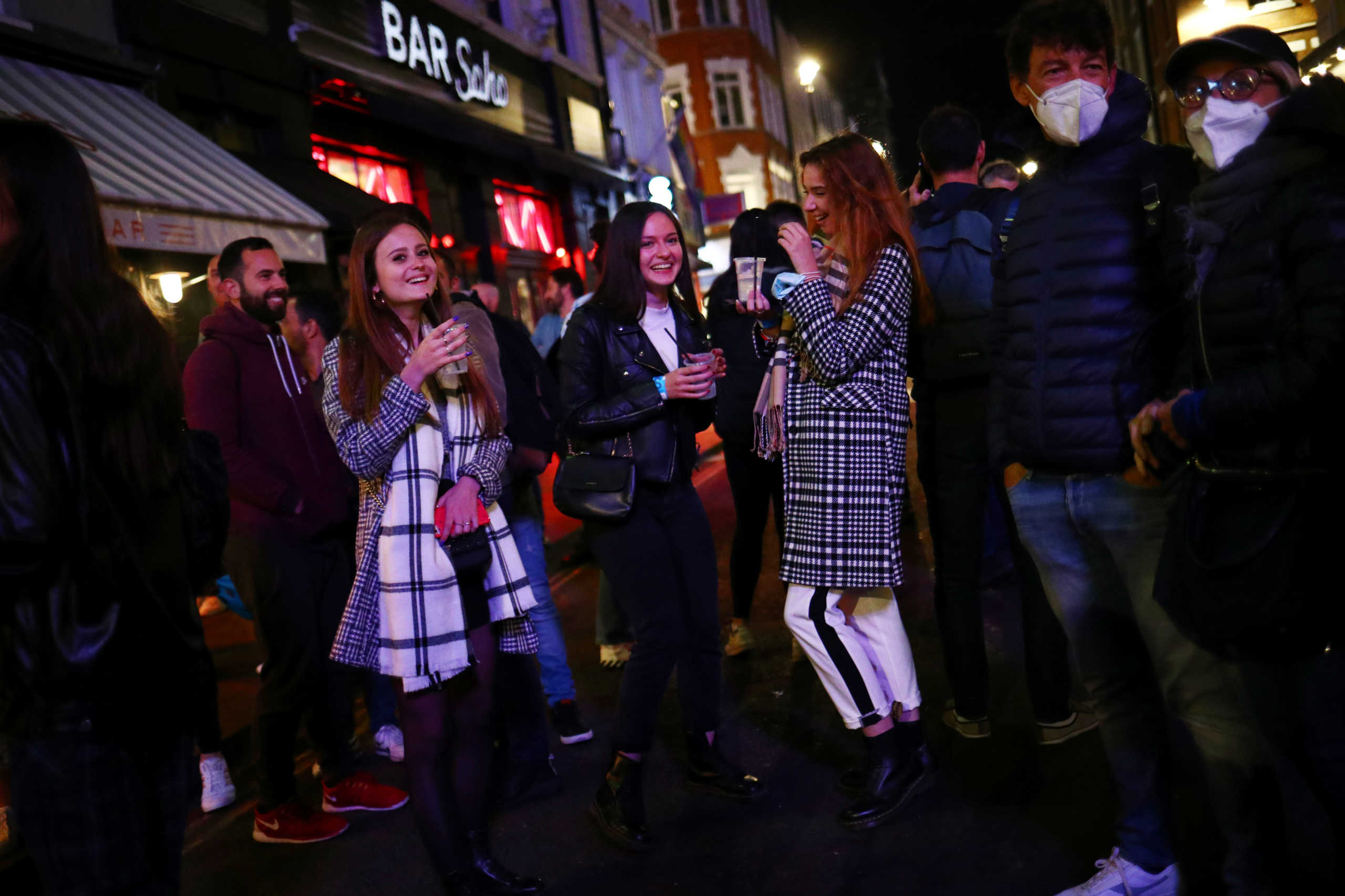 People gather in the Soho area, as new restrictions are implemented for bars and restaurants to curb the spread of the coronavirus disease (COVID-19), in London, Britain, September 24, 2020. REUTERS