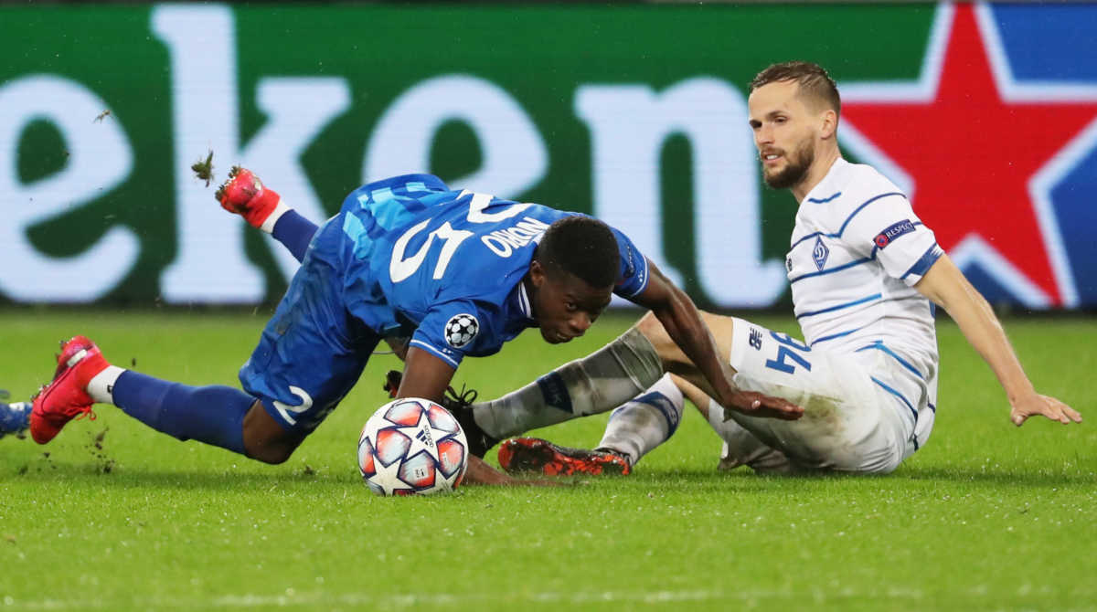 Soccer Football - Champions League - Play-off - First Leg - KAA Gent v Dynamo Kyiv - The Ghelamco Arena, Ghent, Belgium - September 23, 2020  Dynamo Kyiv's Tomasz Kedziora in action with Gent's Nurio Fortuna REUTERS
