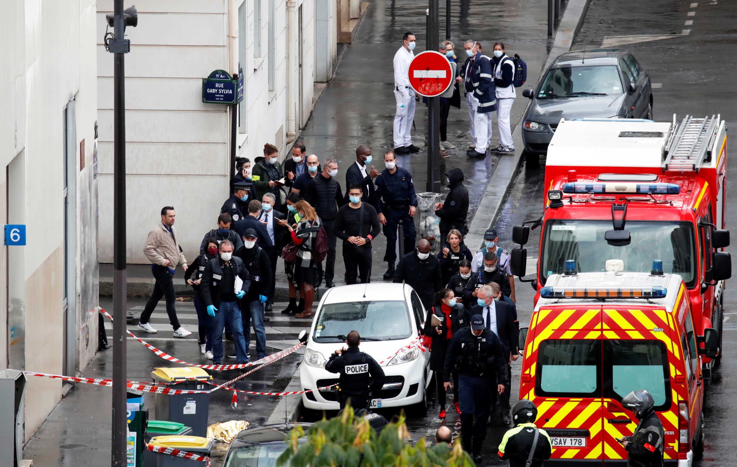 General view as police officers investigate the scene of an incident near the former offices of French magazine Charlie Hebdo, in Paris, France September 25, 2020. REUTERS